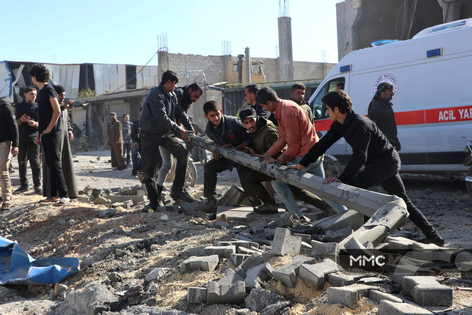 People gather at the site of an explosion in al-Bab, Syria November 24, 2020 in this picture obtained from social media. MMC