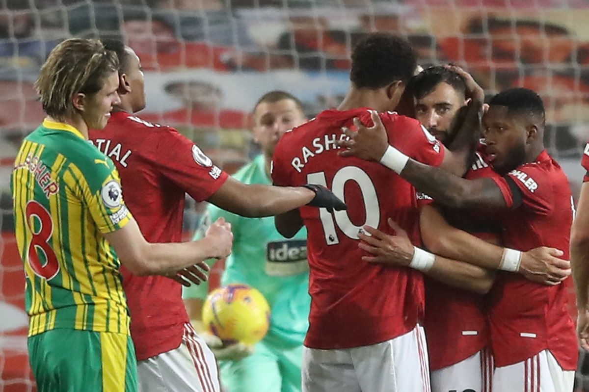 Soccer Football - Premier League - Manchester United v West Bromwich Albion - Old Trafford, Manchester, Britain - November 21, 2020  Manchester United's Bruno Fernandes celebrates scoring their first goal with teammates Pool via REUTERS