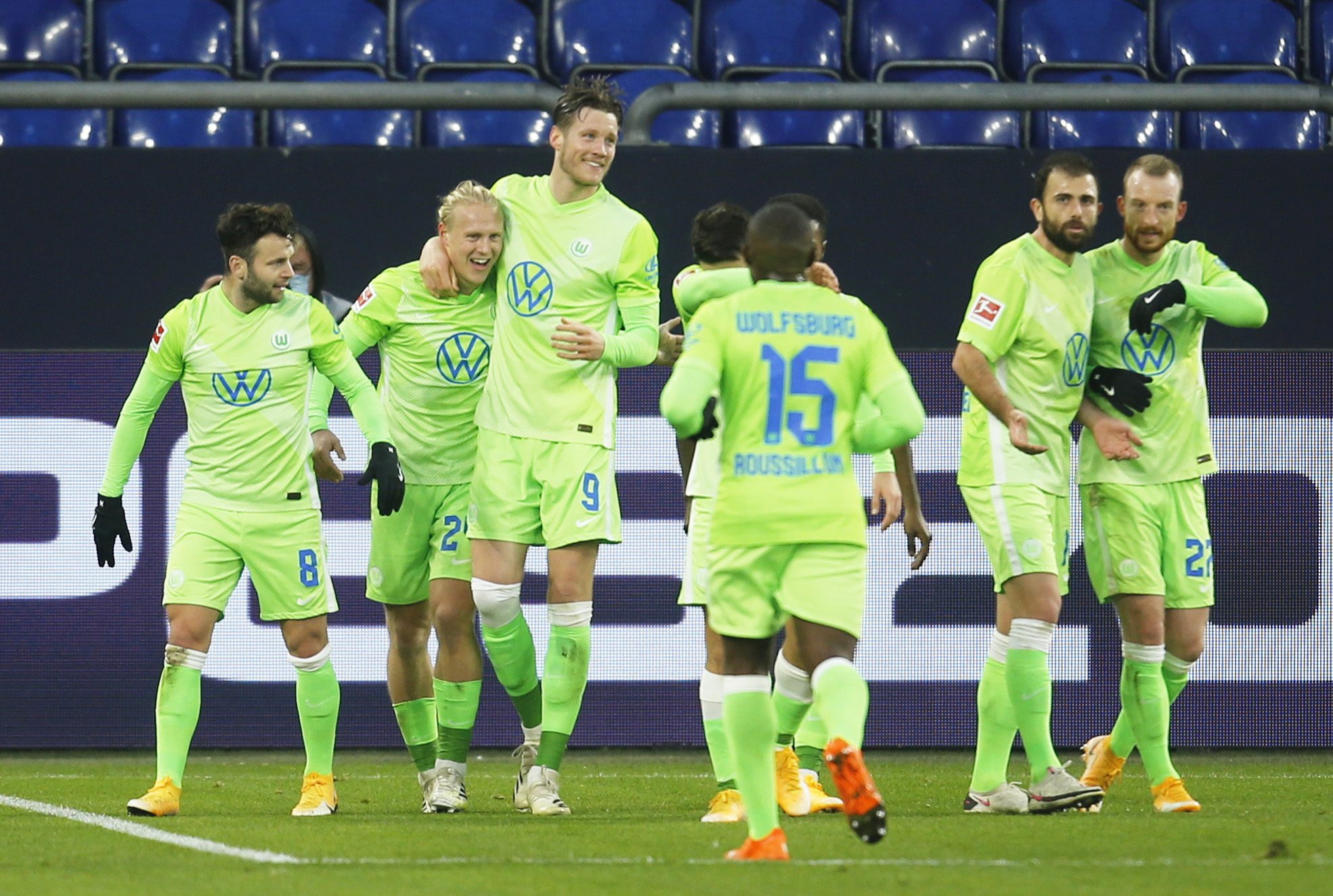 Soccer Football - Bundesliga - Schalke 04 v VfL Wolfsburg - Veltins-Arena, Gelsenkirchen, Germany - November 21, 2020 VfL Wolfsburg's Xaver Schlager celebrates scoring their second goal with teammates REUTERS