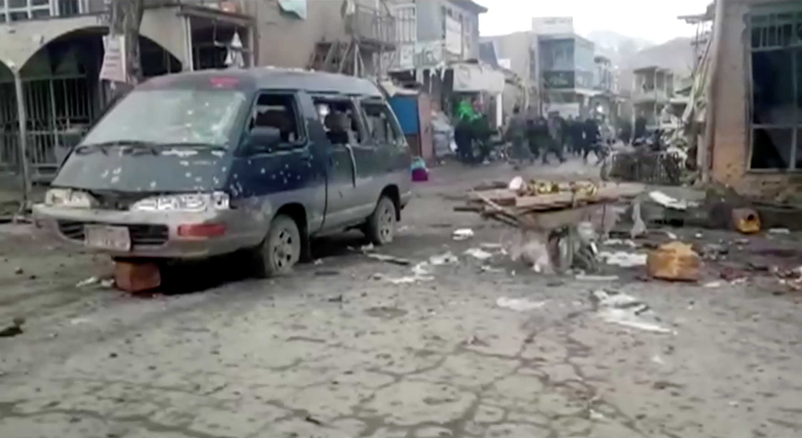 A burnt vehicle is seen among debris after twin explosions in Bamiyan province, Afghanistan November 24, 2020, in this still image taken from video.  1TV