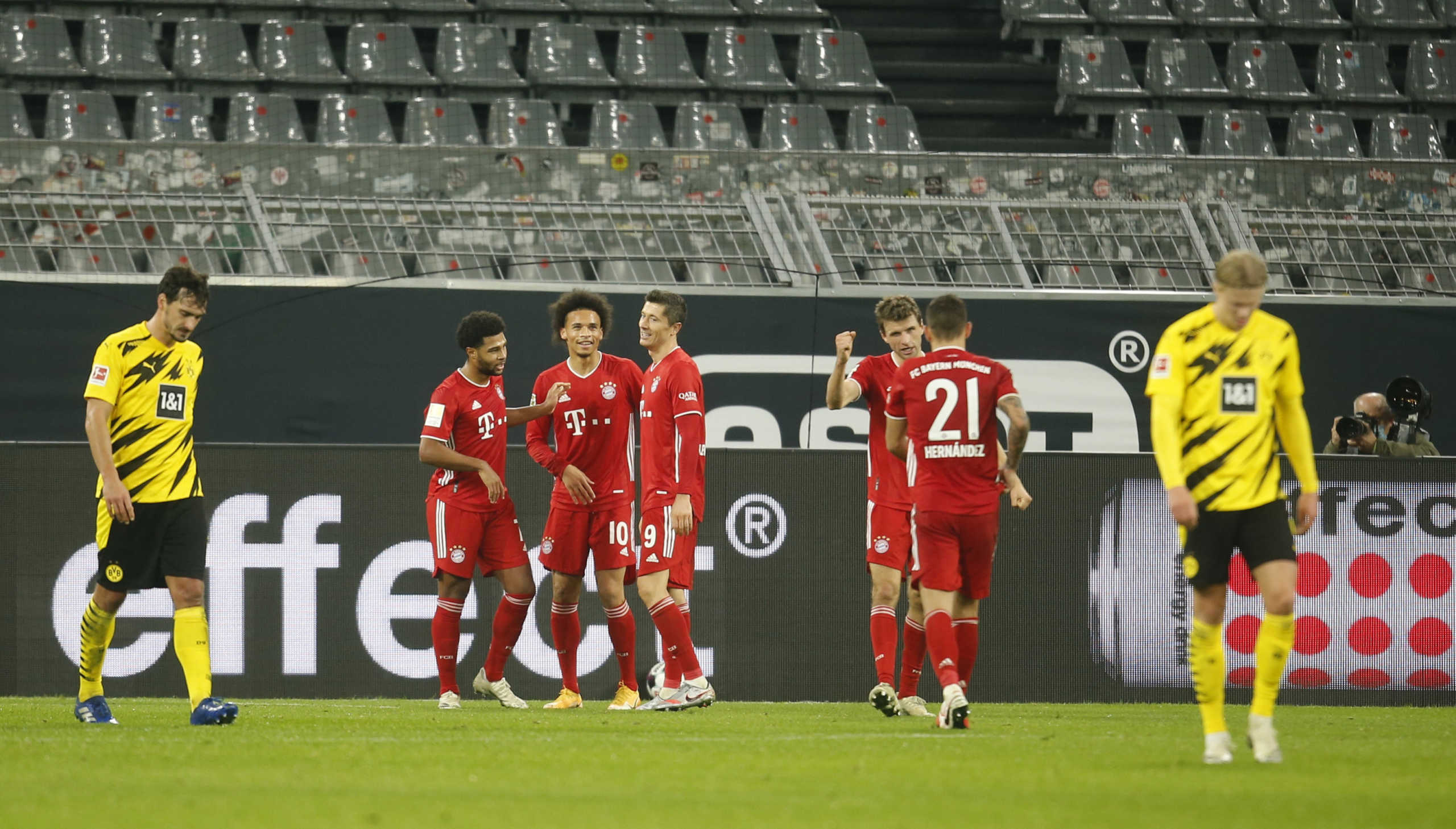 Soccer Football - Bundesliga - Borussia Dortmund v Bayern Munich - Signal Iduna Park, Dortmund, Germany - November 7, 2020  Bayern Munich's Leroy Sane celebrates scoring their third goal with teammates Pool via REUTERS