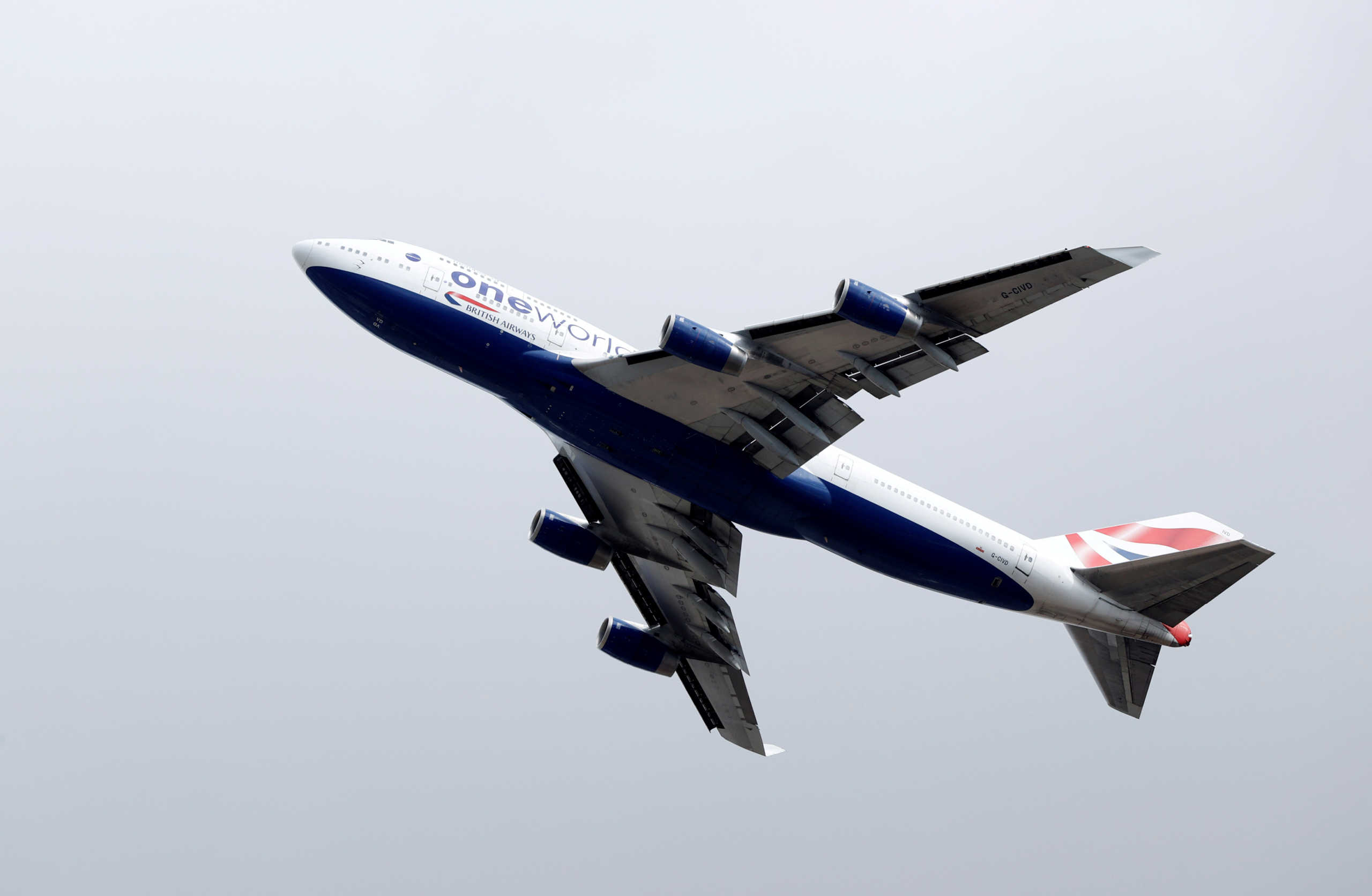 FILE PHOTO: A British Airways Boeing 747 G-CIVD leaves London Heathrow airport on its final flight, the first of 31 jumbo jets to be retired early by the airline due to the coronavirus disease (COVID-19) pandemic, in London, Britain August 18, 2020. REUTERS
