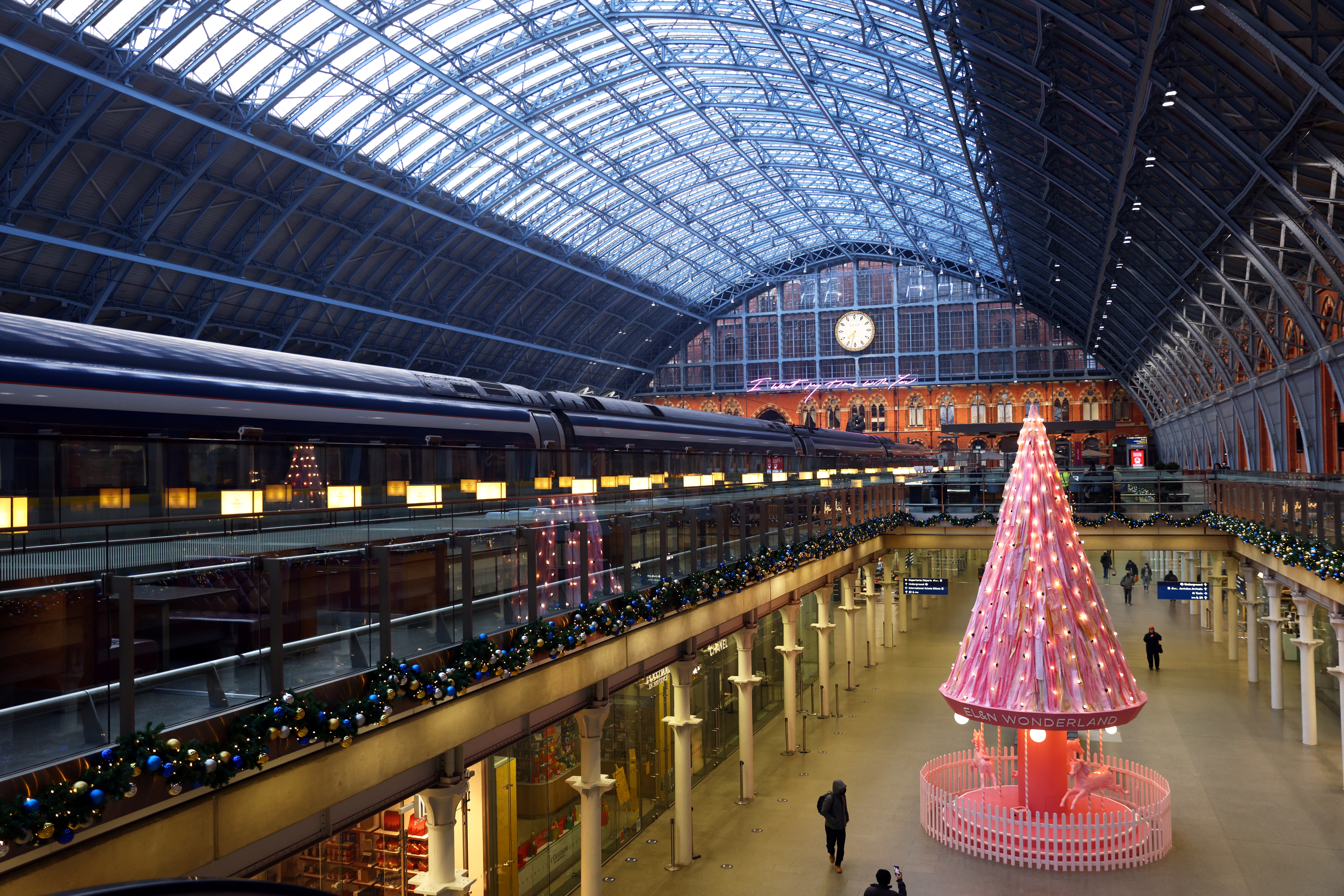 A pink Christmas tree with messages written by NHS workers stands in St Pancras International rail station amid the coronavirus disease (COVID-19) outbreak in London, Britain, November 6, 2020. REUTERS