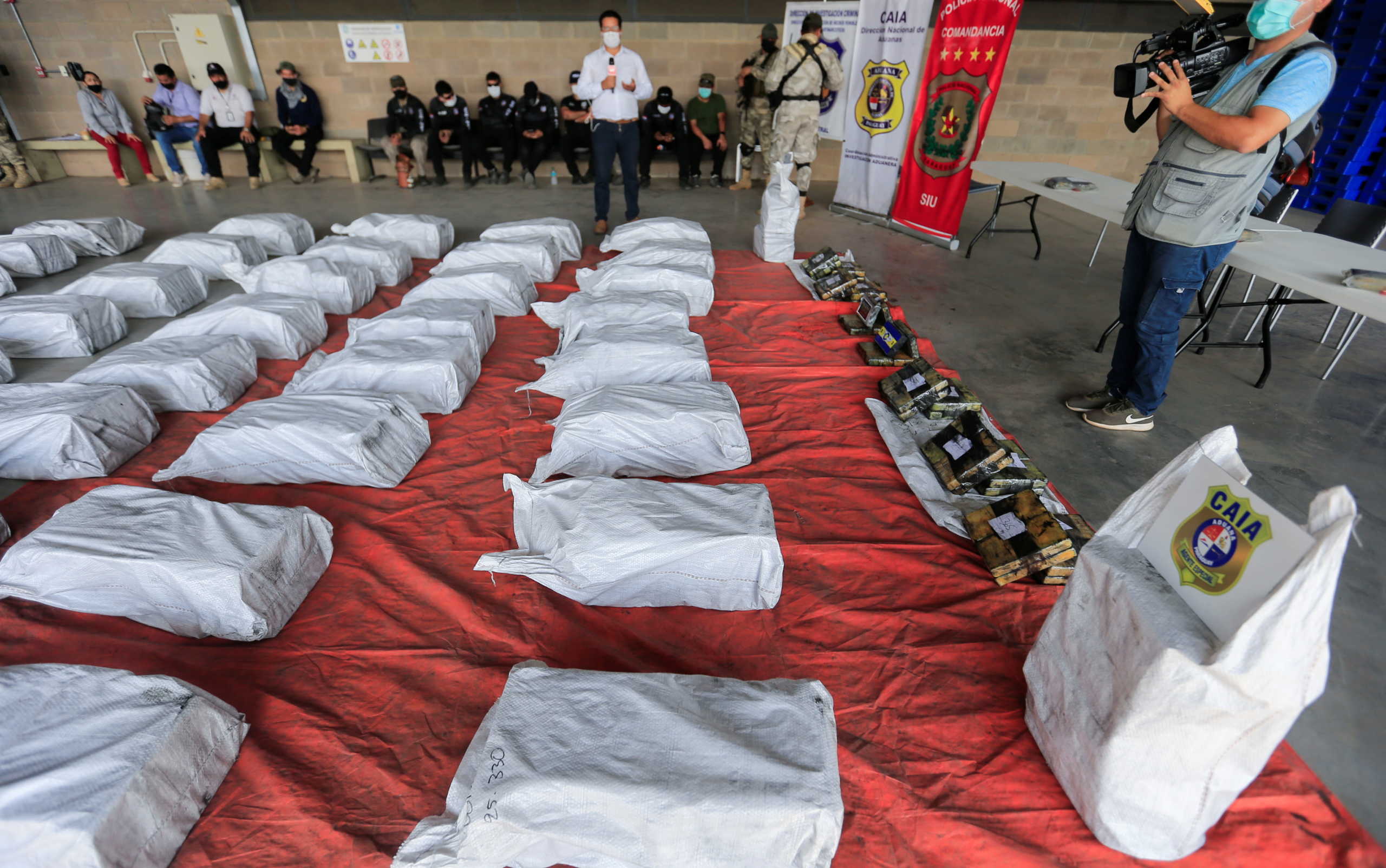 Packages of cocaine that were hidden in a shipment of six charcoal containers that were to be shipped to Israel are seen after being seized by an anti-narcotics unit in the Terport de Villeta port in Villeta near Asuncion, Paraguay, October 20, 2020. REUTERS