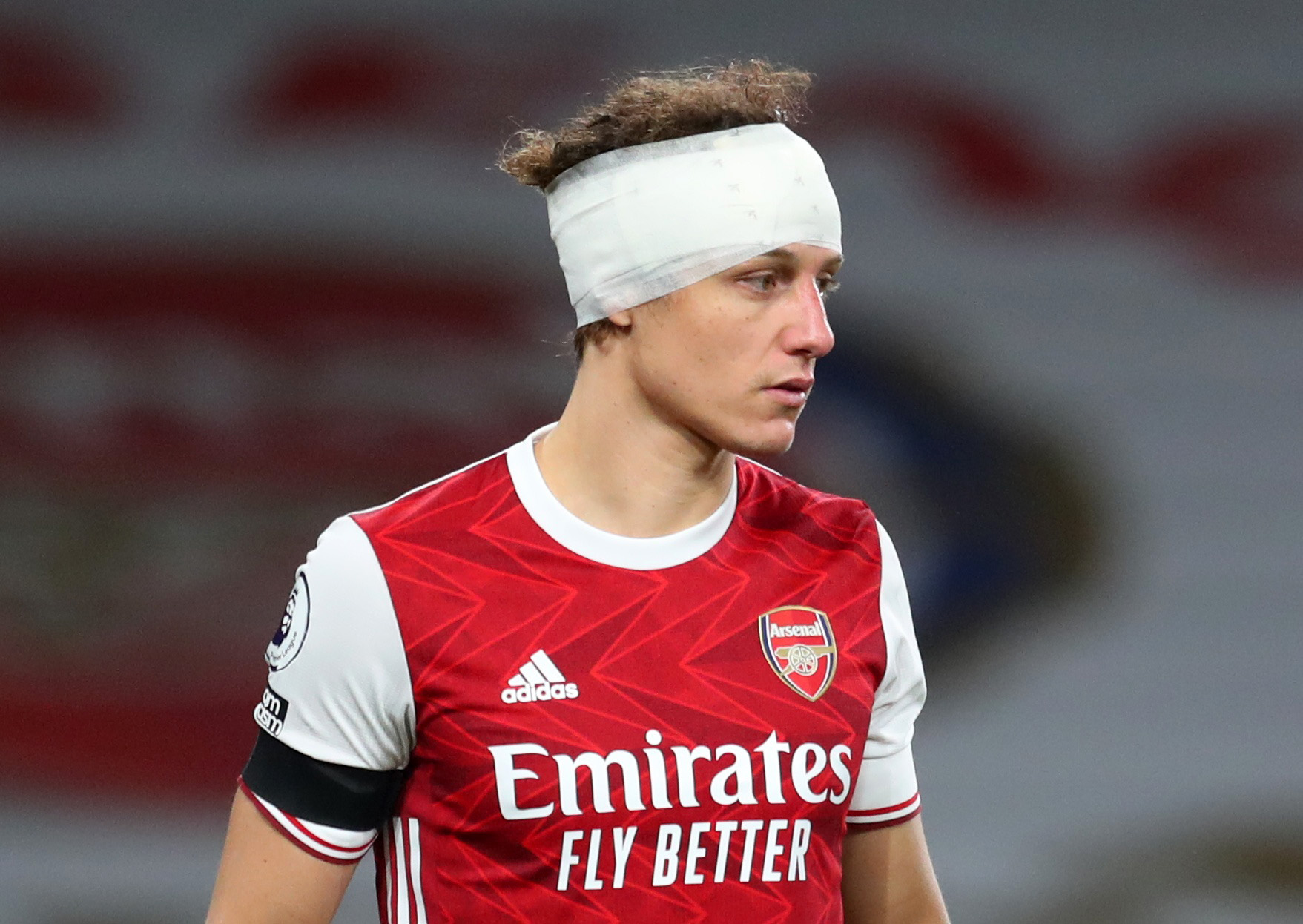 Soccer Football - Premier League - Arsenal v Wolverhampton Wanderers - Emirates Stadium, London, Britain - November 29, 2020 Arsenal's David Luiz  is seen with a bandage on his head, following a collision earlier Pool via REUTERS