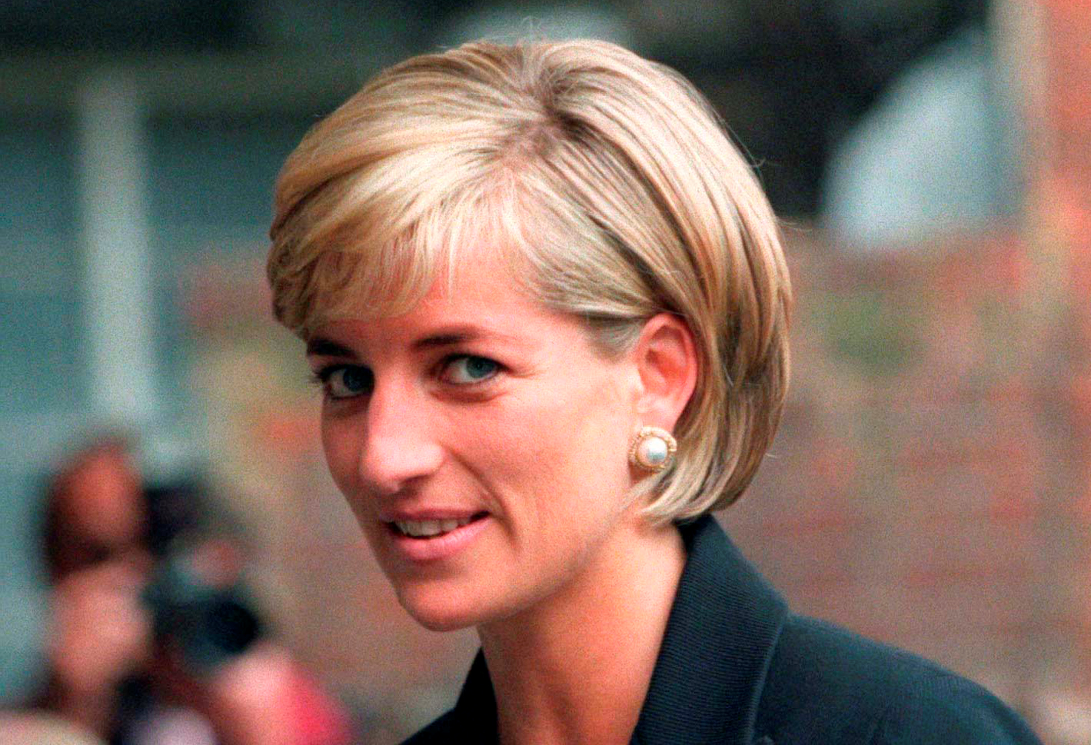 FILE PHOTO: Princess Diana arrives at the Royal Geographical Society in London for a speech on the dangers of landmines throughout the world June 12, 1997. REUTERS