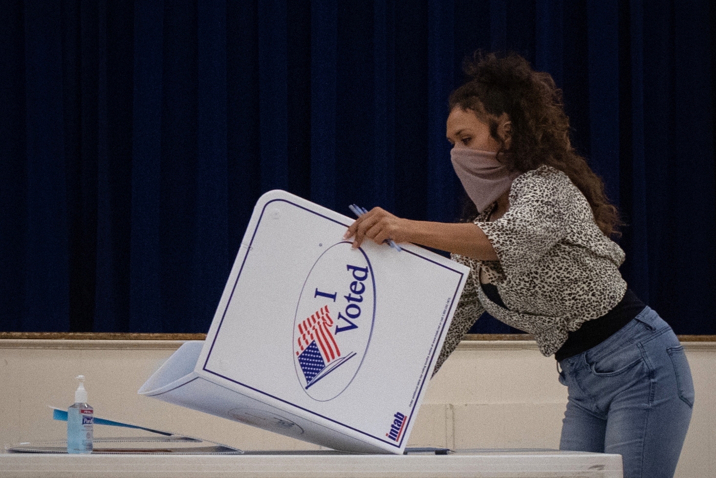 Presidio County election judge Lauren Martinez folds a booth after polls and voting ended for the 2020 U.S. presidential election in Marfa, Texas, U.S., November 3, 2020. REUTERS