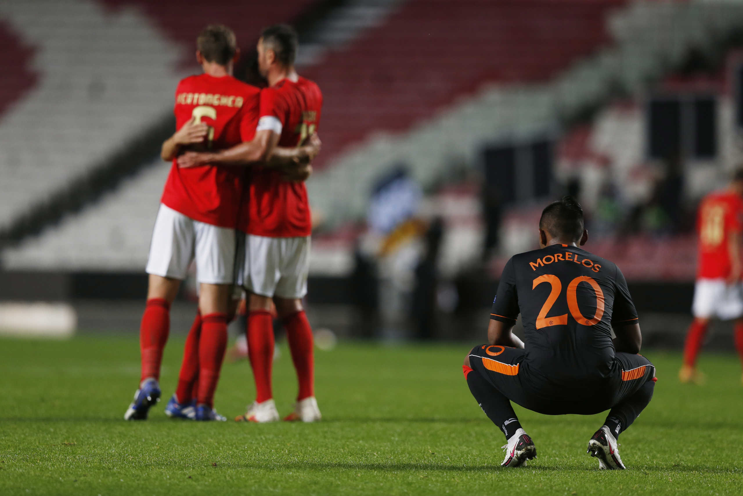 Soccer Football - Europa League - Group D - Benfica v Rangers - Estadio da Luz, Lisbon, Portugal - November 5, 2020   Rangers' Alfredo Morelos looks dejected while Benfica players celebrate at the end of the match REUTERS
