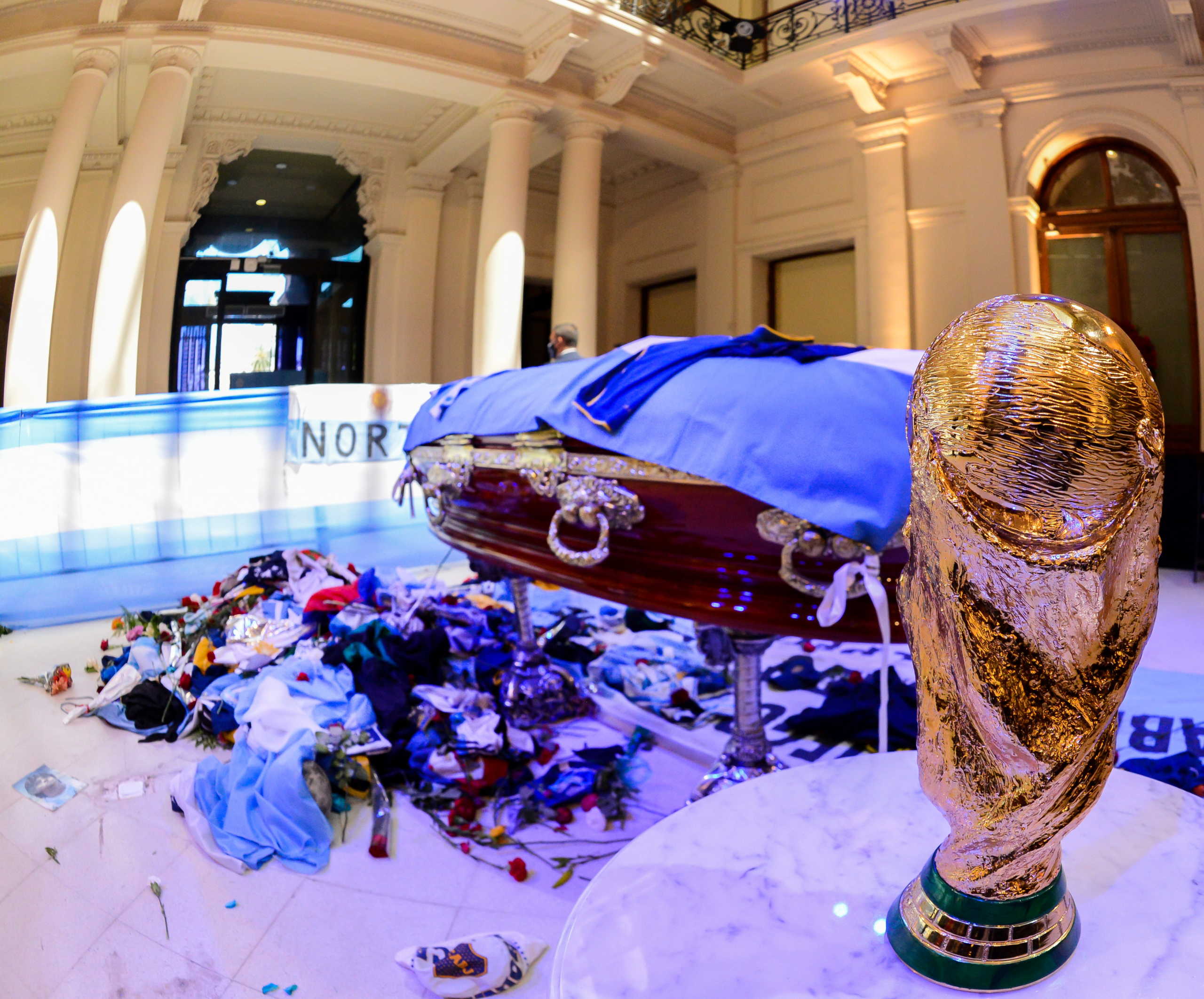 A replica of the World Cup Trophy stands next to the casket of soccer legend Diego Maradona at the presidential palace Casa Rosada, in Buenos Aires, Argentina November 26, 2020. Argentina Presidency