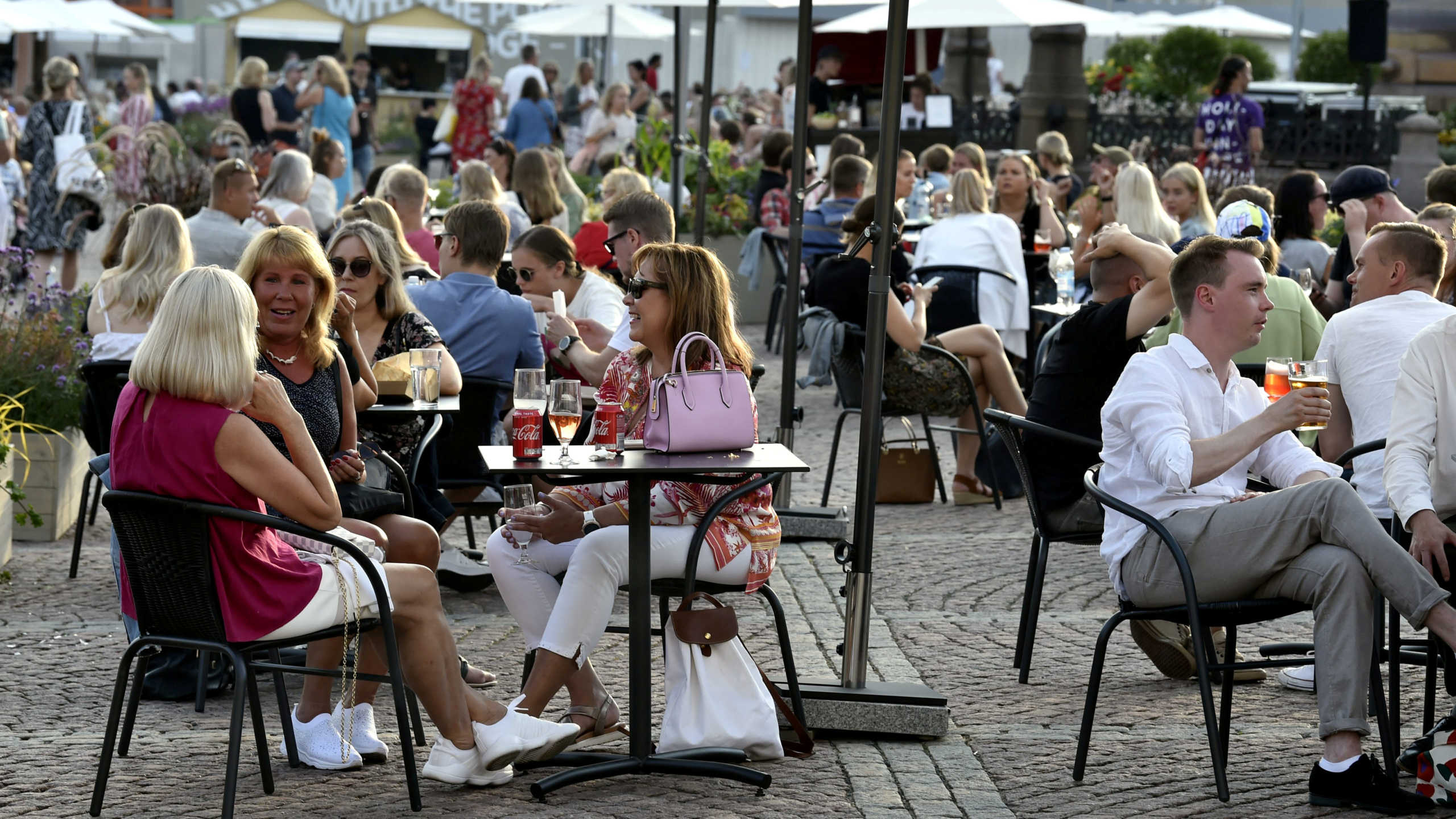 FILE PHOTO: People enjoy warm summer evening, following eased lockdown measures amid the coronavirus disease (COVID-19) outbreak in Helsinki, Finland on July 17, 2020. Lehtikuva