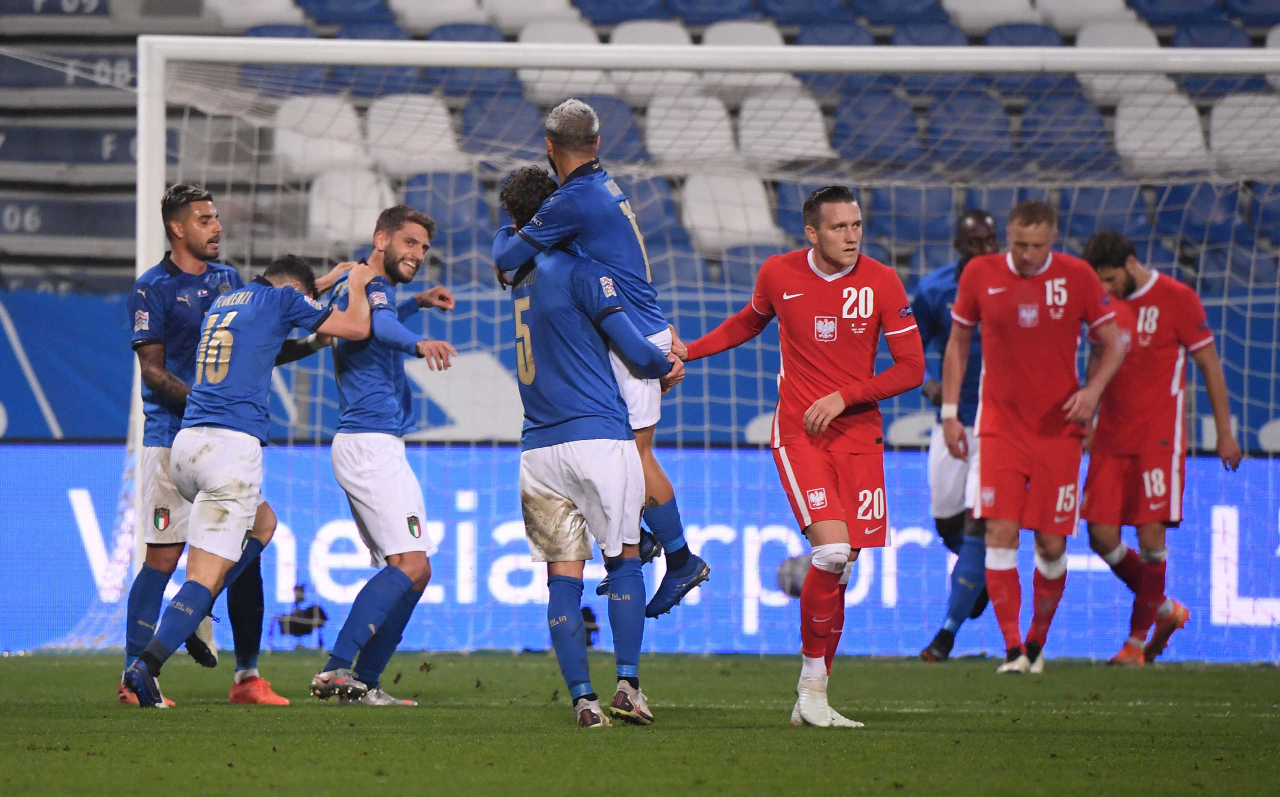 Soccer Football - UEFA Nations League - League A - Group 1 - Italy v Poland - Mapei Stadium - Citta del Tricolore, Reggio Emilia, Italy - November 15, 2020 Italy's Domenico Berardi celebrates scoring their second goal with teammates REUTERS
