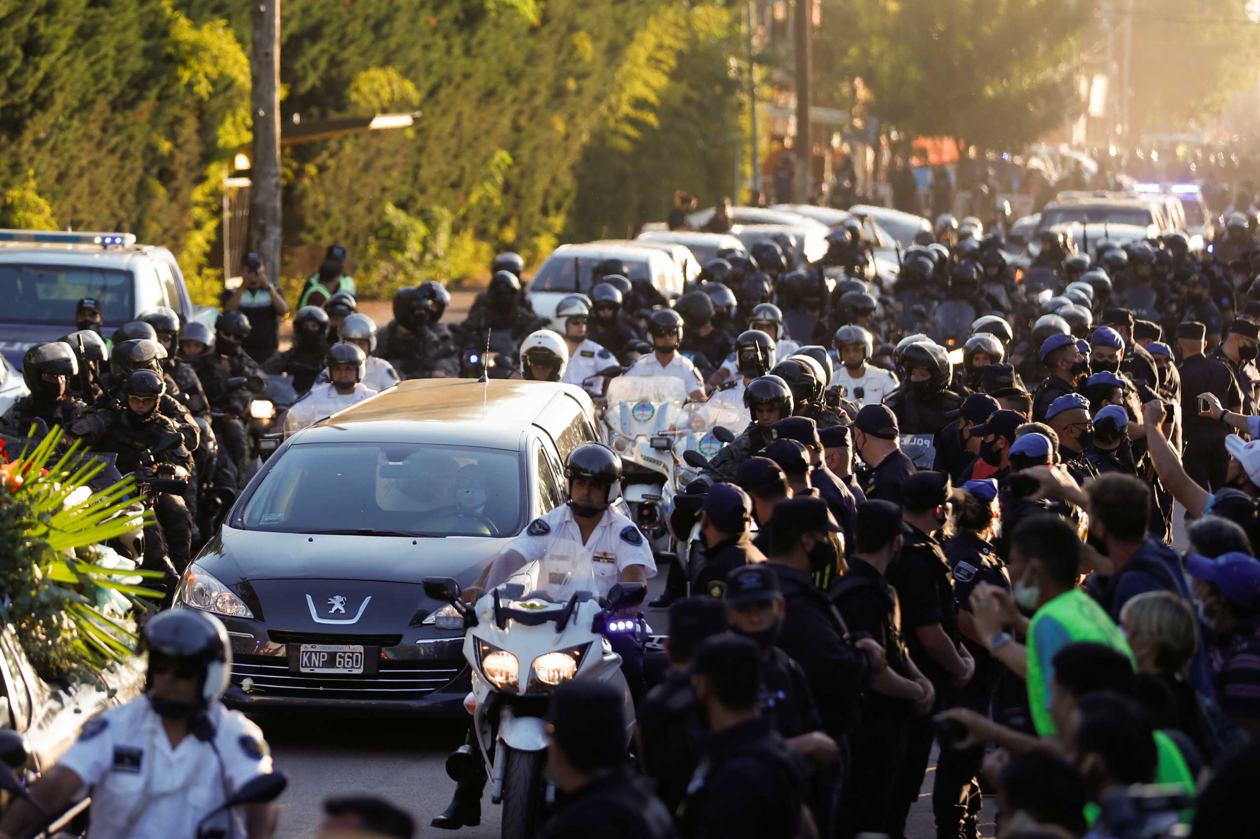 The hearse carrying the casket of soccer legend Diego Maradona arrives at the cemetery in Buenos Aires, Argentina, November 26, 2020. REUTERS