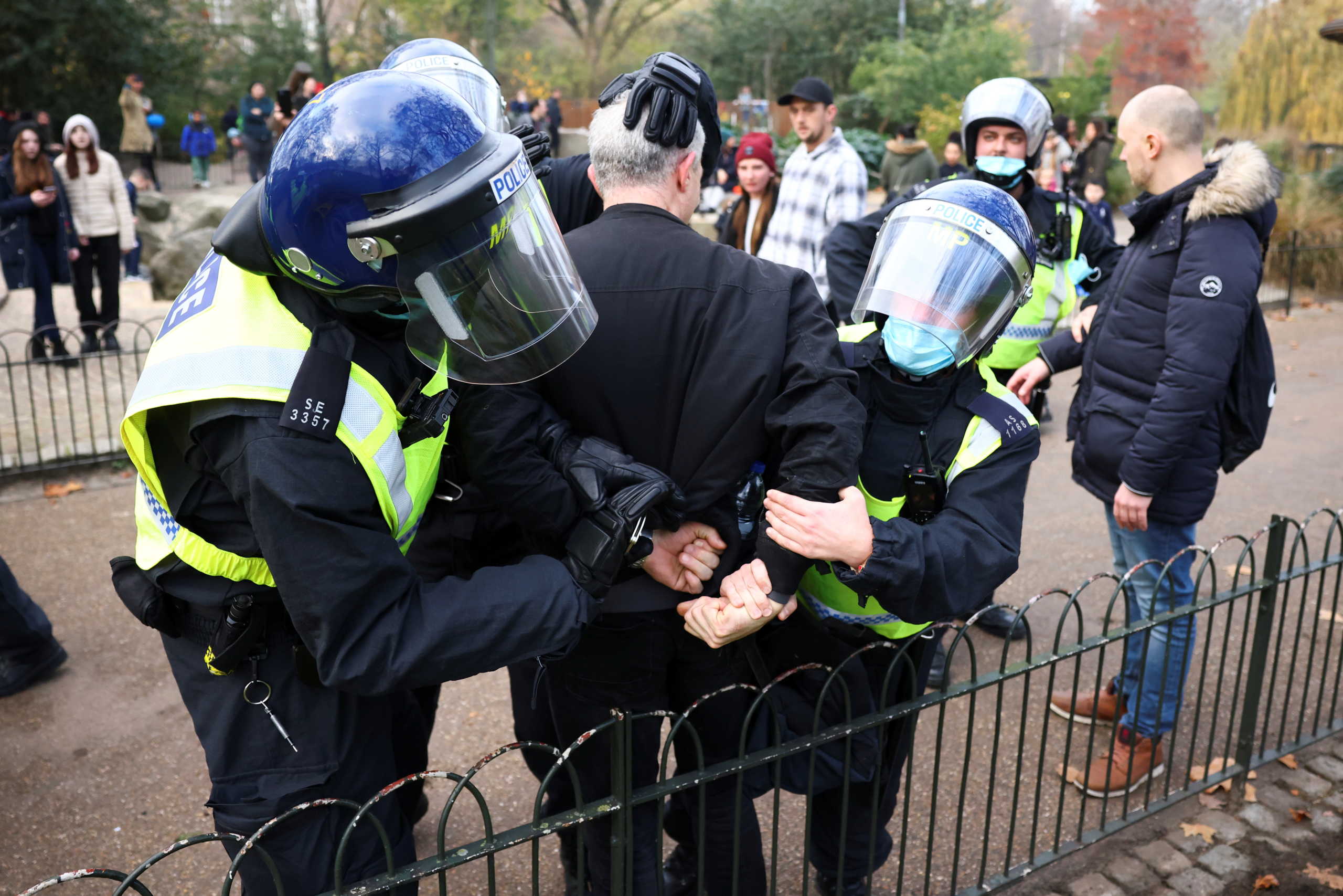 Police officers detain an anti-lockdown protestor during a demonstration amid the coronavirus disease (COVID-19) outbreak in London, Britain November 28, 2020. REUTERS