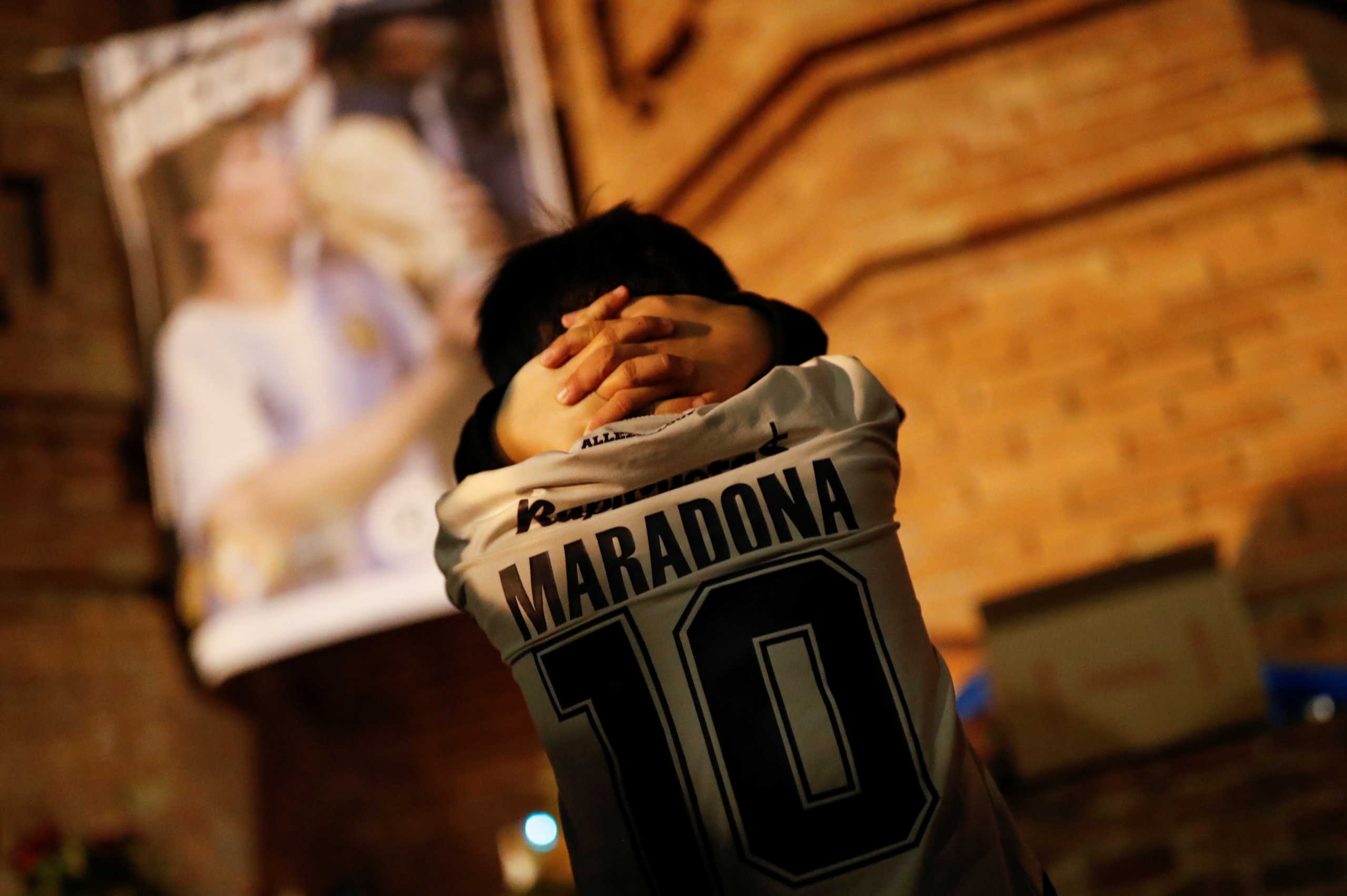 Five years old Inaki Gonzalez Reynoso, who was born in Argentina, participates on a tribute to late Argentine soccer legend Diego Armando Maradona the day after his death, in Barcelona, Spain, November 26, 2020.  REUTERS