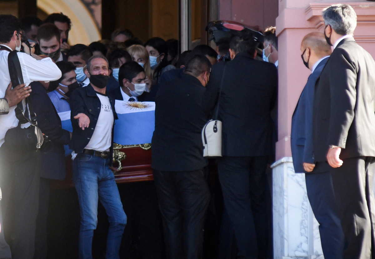 Pallbearers carry the casket of soccer legend Diego Maradona after a public viewing at the presidential palace Casa Rosada, in Buenos Aires, Argentina November 26, 2020. REUTERS