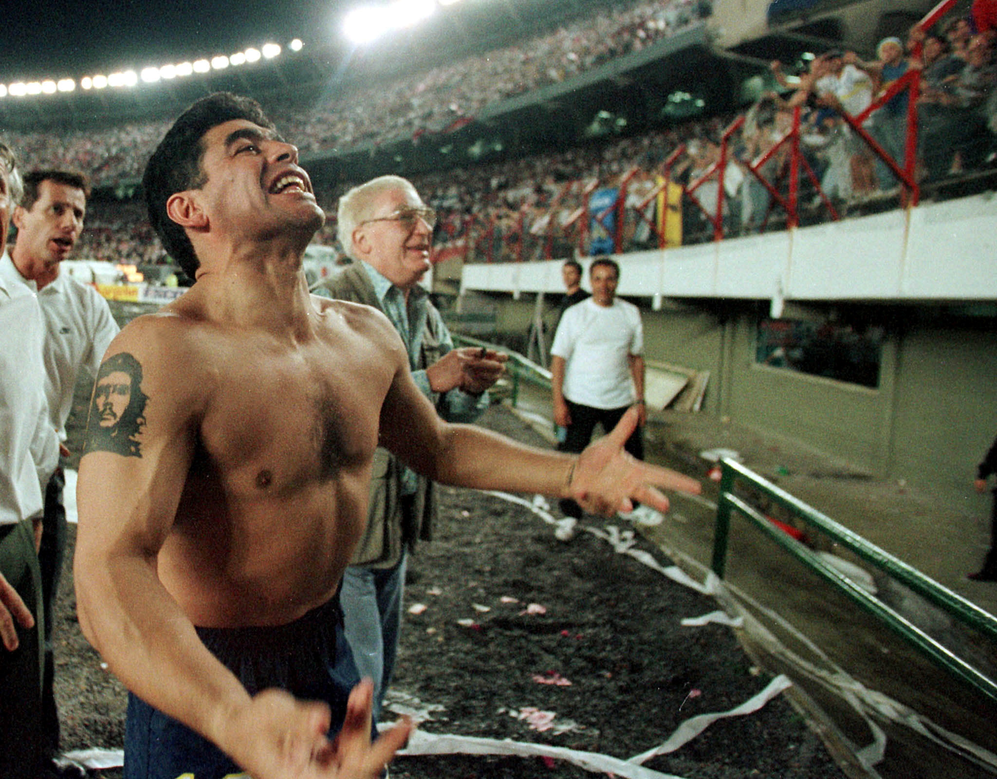 FILE PHOTO: Argentine soccer star Diego Maradona celebrates before thousands of spectators after his team, Boca Juniors, beat their rival River Plate in the Argentine 'classic' confrontation between the two most popular soccer teams October 25, 1997. REUTERS