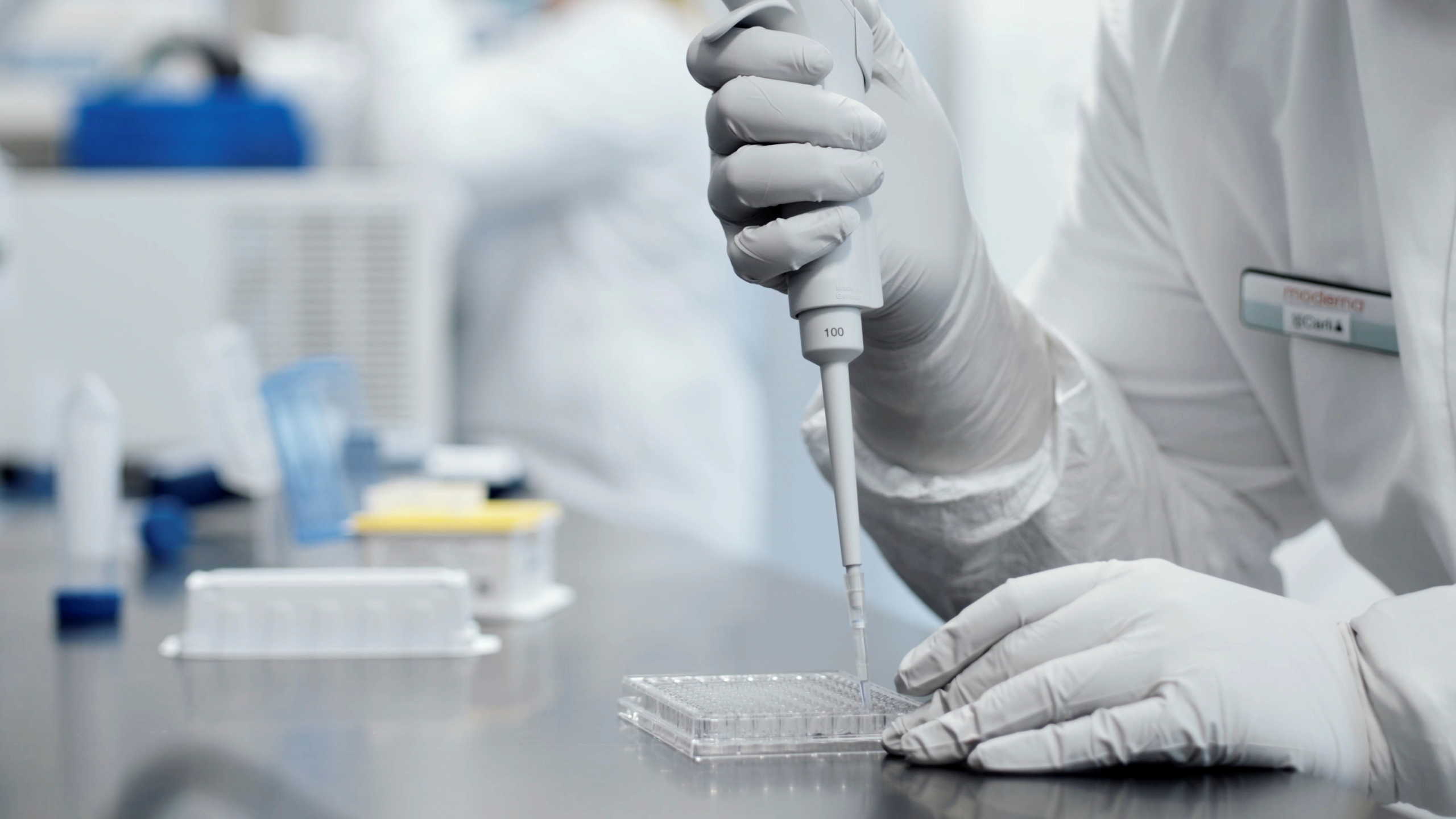 A researcher works in a lab run by Moderna Inc, who said November 16, 2020 that its experimental vaccine was 94.5% effective in preventing COVID-19 based on interim data from a late-stage clinical trial, in an undated still image from video. Moderna Inc