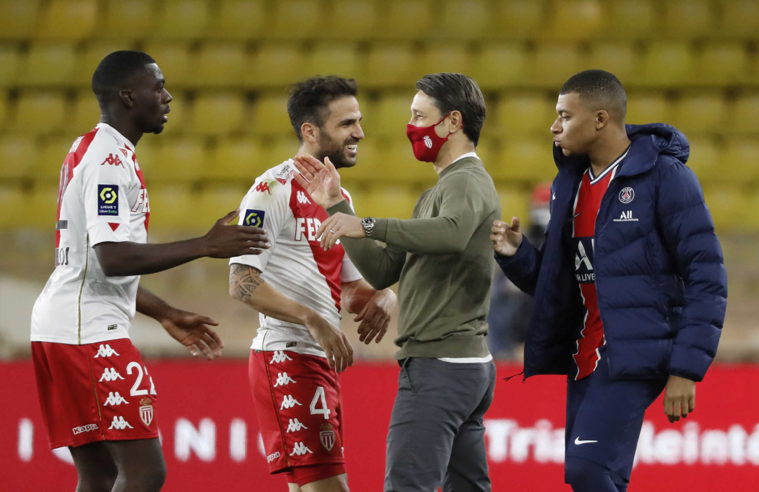Soccer Football - Ligue 1 - AS Monaco v Paris St Germain - Stade Louis II, Monaco - November 20, 2020  AS Monaco coach Niko Kovac celebrates after the match with Cesc Fabregas REUTERS