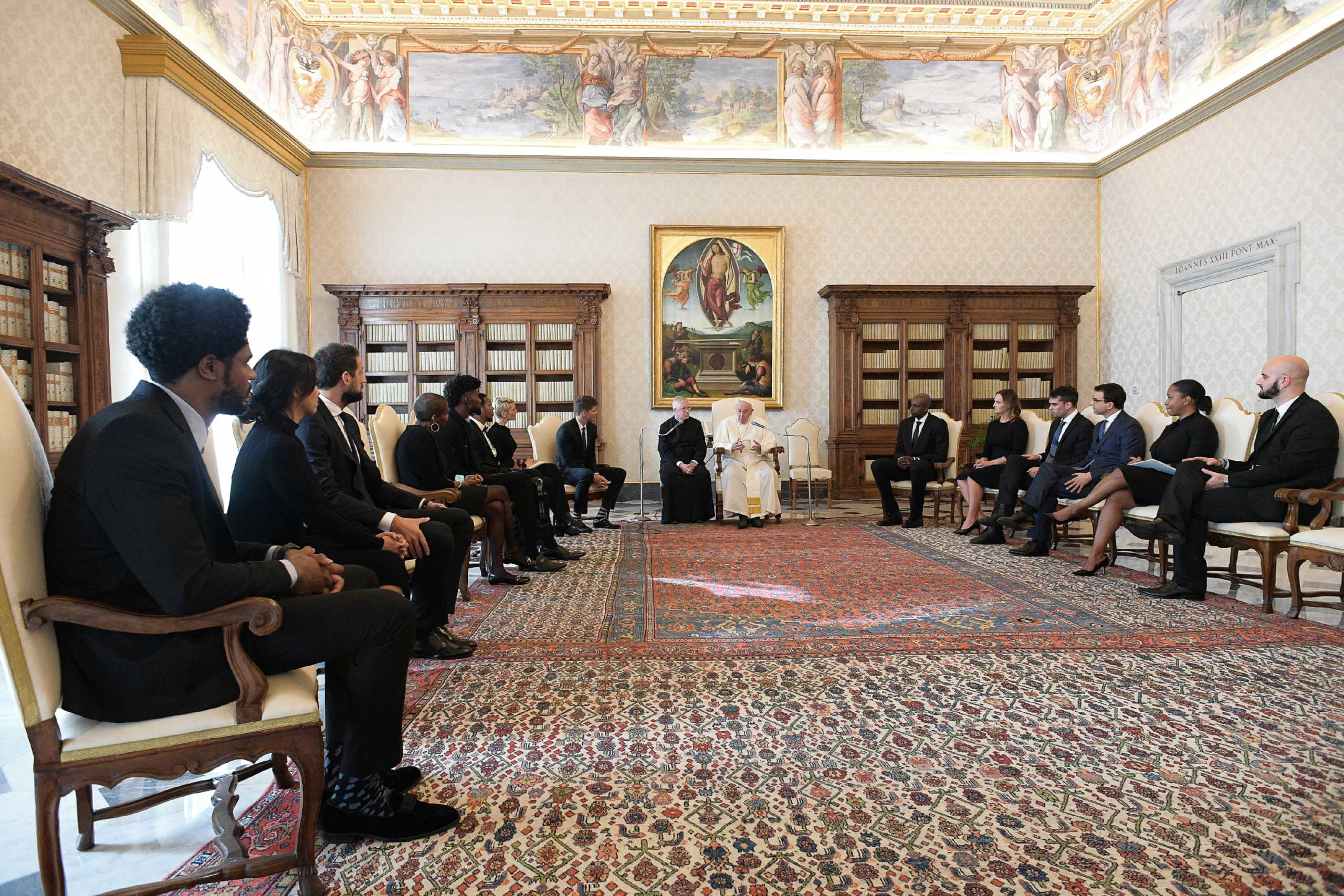 Pope Francis meets a delegation of five NBA players and officials from the National Basketball Players Association at the Vatican November 23, 2020. Vatican Media