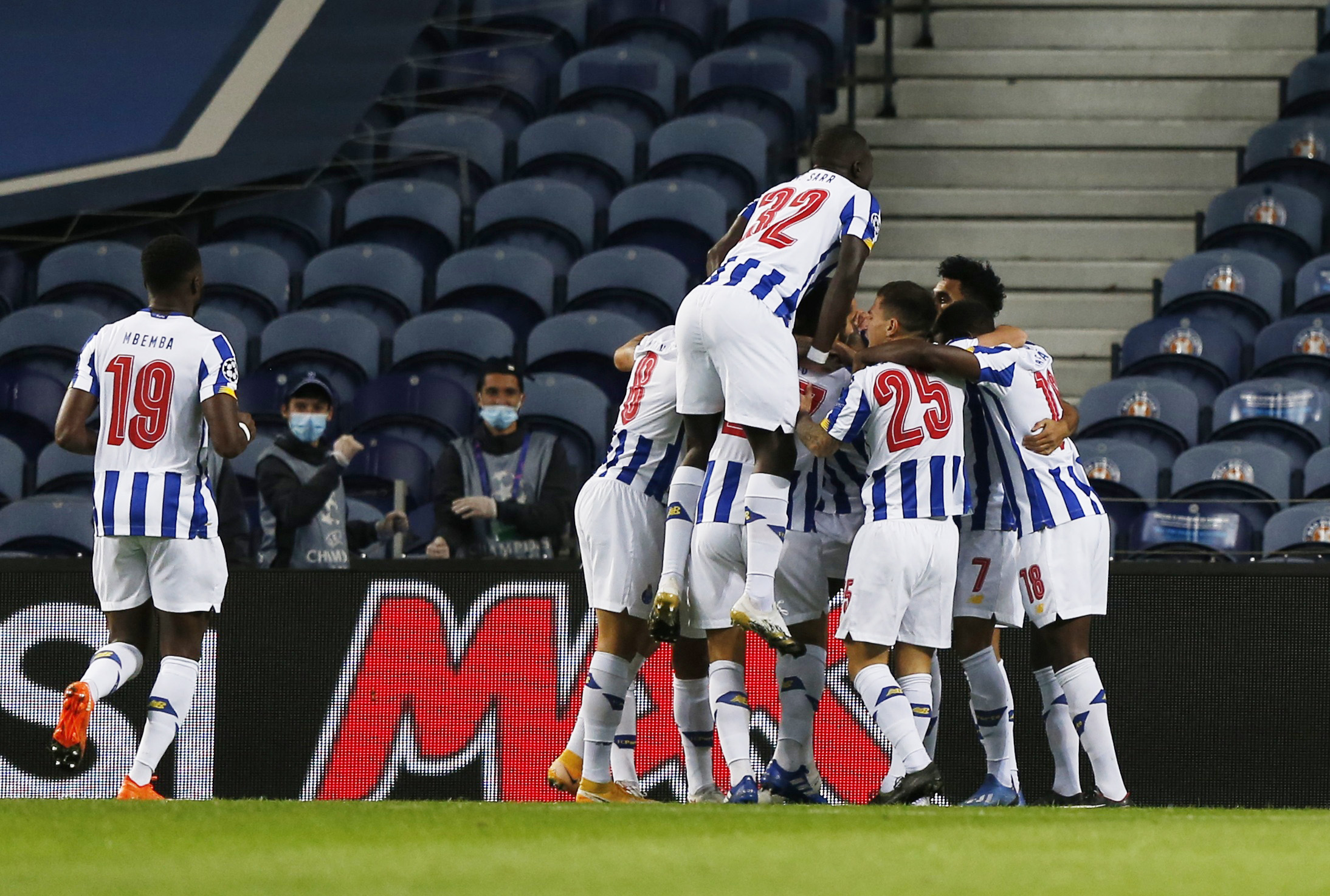 Soccer Football - Champions League - Group C - FC Porto v Olympique de Marseille - Estadio do Dragao, Porto, Portugal - November 3, 2020 FC Porto's Moussa Marega celebrates scoring their first goal with teammates REUTERS