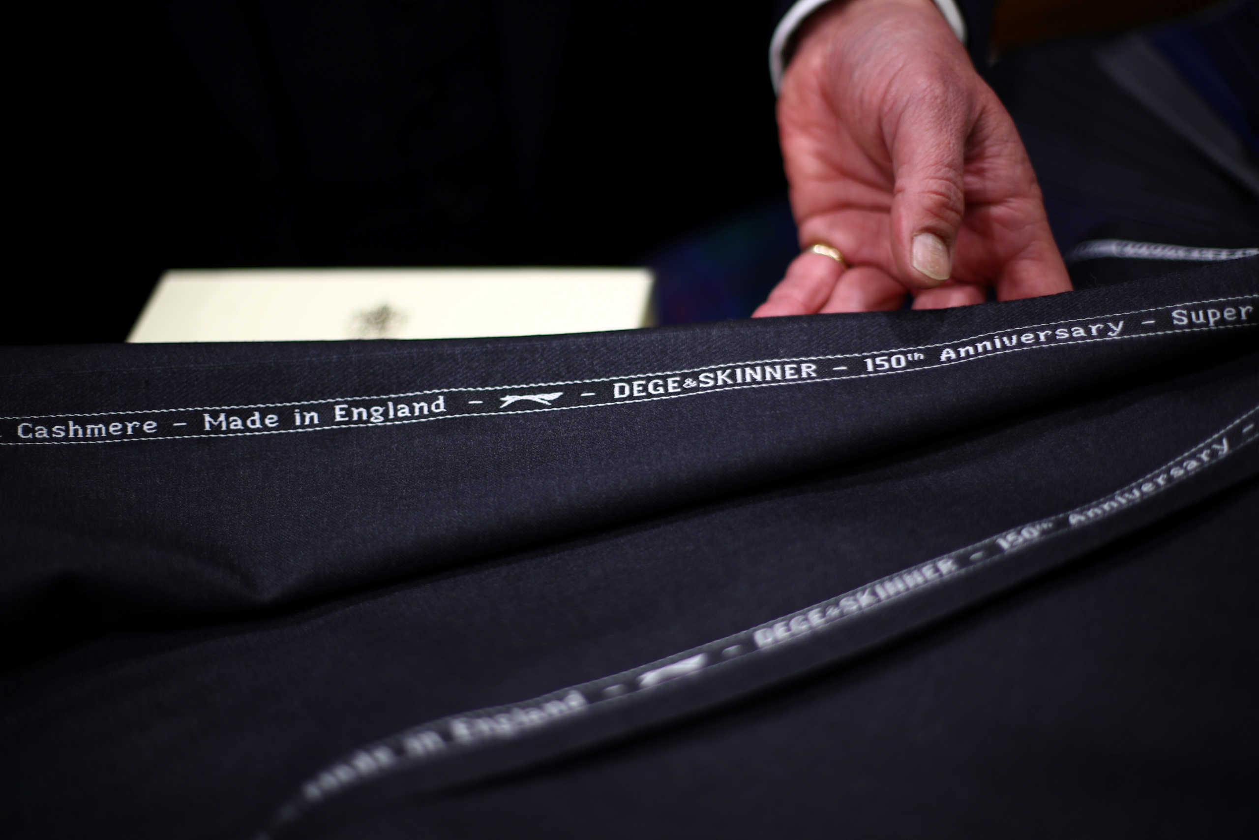 Embroidered cloth is seen on a work bench in the Dege & Skinner tailors on Savile Row, amid the coronavirus disease (COVID-19) outbreak, in London, Britain October 7, 2020. William Skinner is a fifth-generation tailor and the third to run the Savile Row shop Dege & Skinner. Established in 1865, Dege & Skinner is one of only two family-owned Savile Row firms. Its clients include businessmen, generals and royals including Prince Harry, who chose the brand for his wedding uniform. Business has been “quite challenging,” but since reopening in June, the shop has seen “quite a lot” of new customers. “It’s been on their bucket list for a long time,” Skinner said about some of his new customers, who think: “if I get COVID, then I might never do this, so let’s do it now’.” “There’s a whole raft of attitudes out there … feedback we’ve had from some of our clients is ‘we’ve had nothing to spend our money on over the last 3-6 months, so I’m going to buy a new suit’.” Nevertheless, orders for the past six months are about one-quarter of what they would normally be. The company usually makes about 500-600 suits a year, starting at £5,500 each. Picture taken October 7, 2020. REUTERS