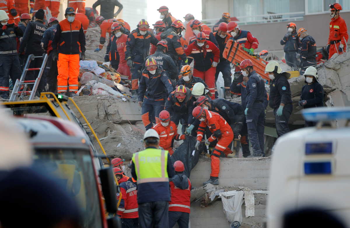 Rescue workers carry an earthquake victim out of a collapsed building in the Aegean port city of Izmir, Turkey, November 1, 2020. REUTERS