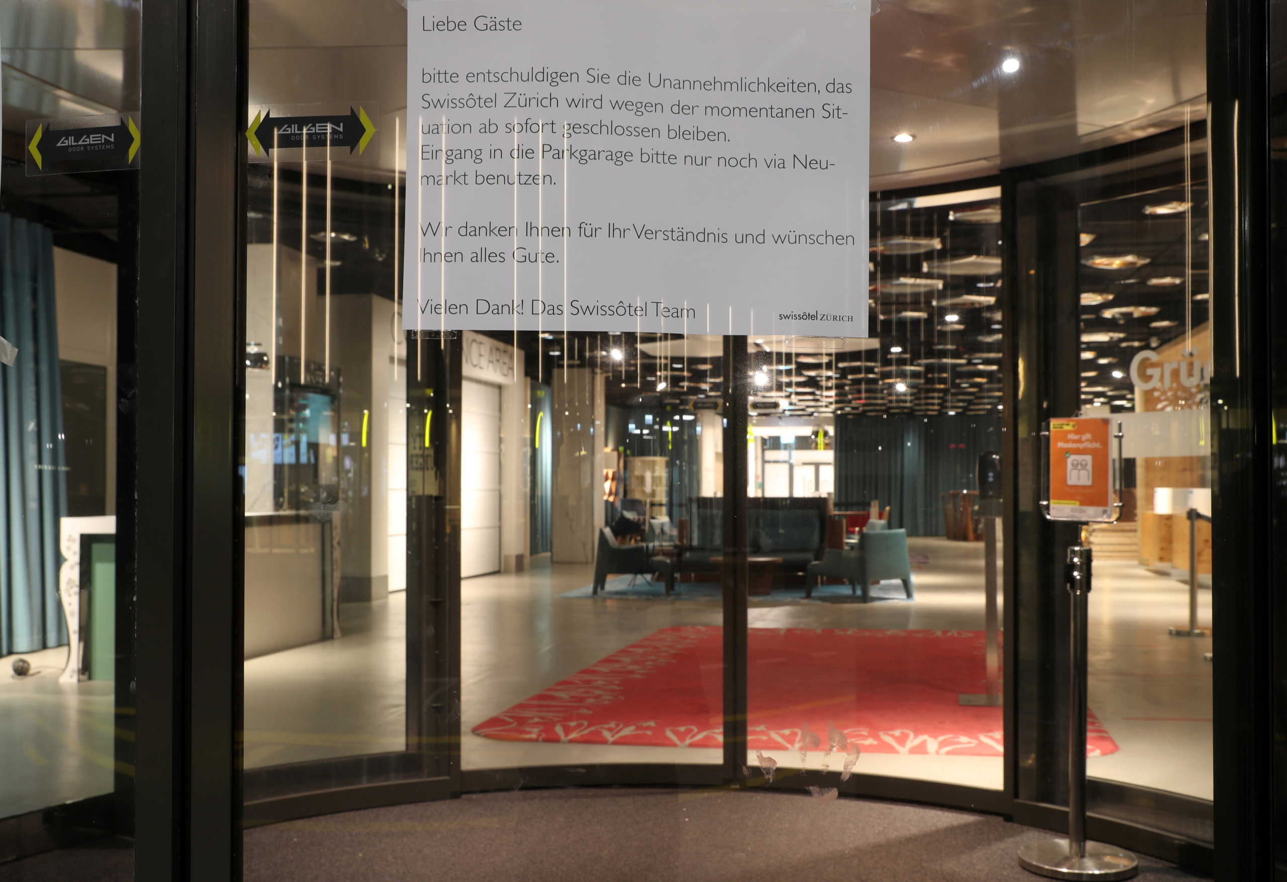 A statement, which explains the closure, is placed at the entrance of the Swissotel hotel, as the spread of the coronavirus disease (COVID-19) continues, in Zurich, Switzerland November 17, 2020.  REUTERS