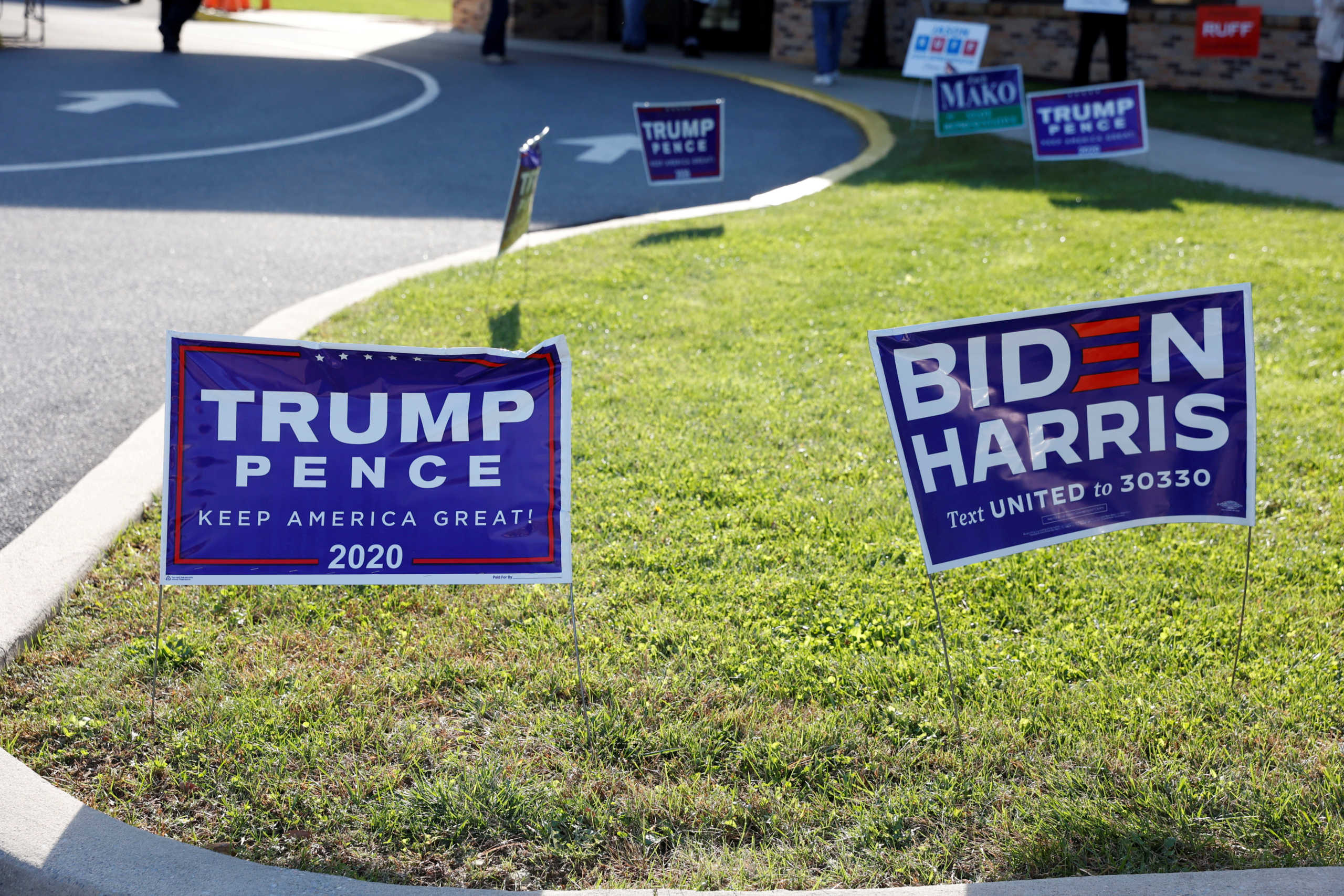 FILE PHOTO: Campaign signs for U.S. President Donald Trump and presidential nominee and former Vice President Joe Biden are seen on Election Day in Cherryville, Pennsylvania, U.S., November 3, 2020. REUTERS