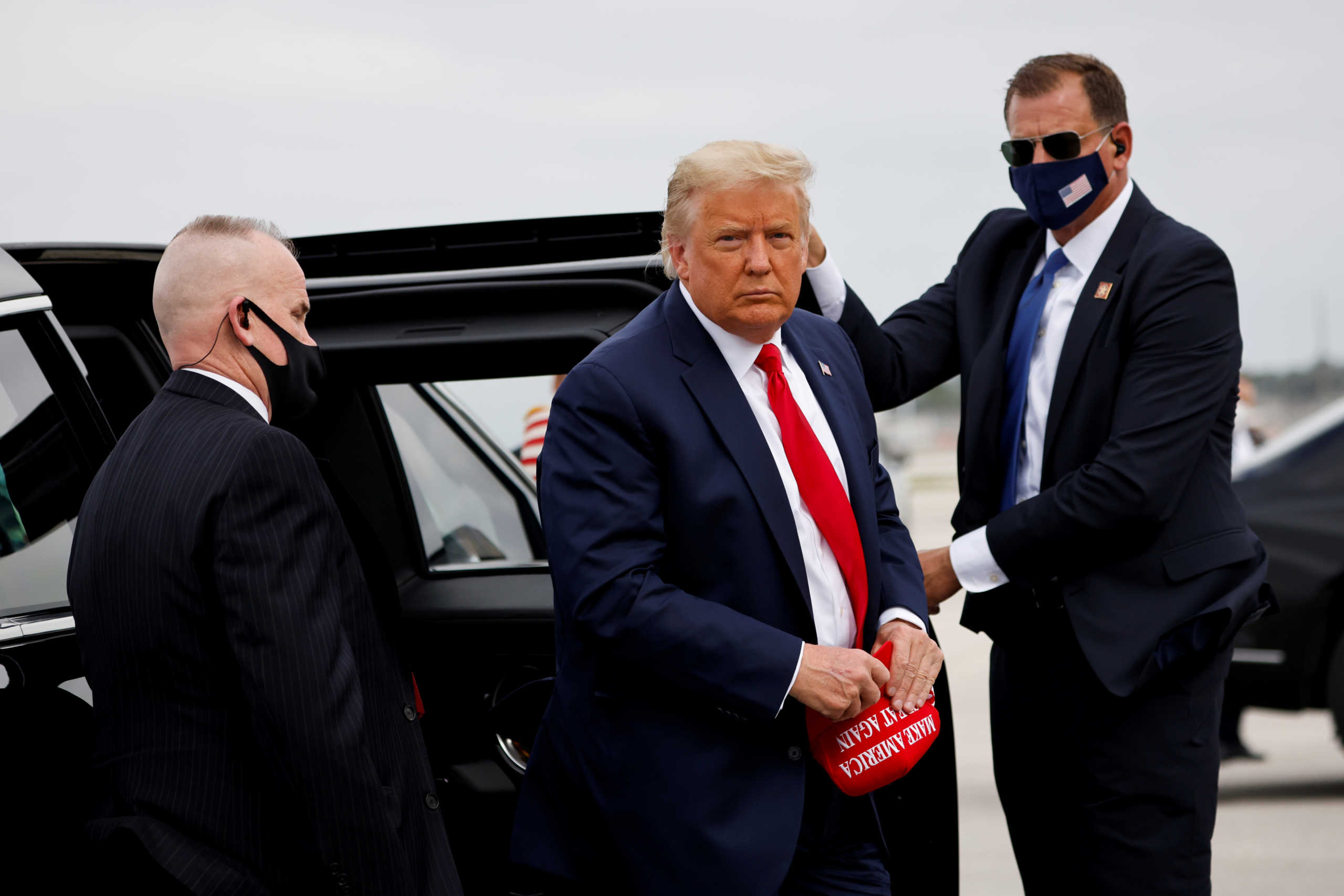 FILE PHOTO: U.S. President Donald Trump arrives to board the Air Force One as he departs Miami for campaign travel to North Carolina, Pennsylvania, Michigan, and Wisconsin at Miami International Airport in Miami, Florida, U.S., November 2, 2020. REUTERS