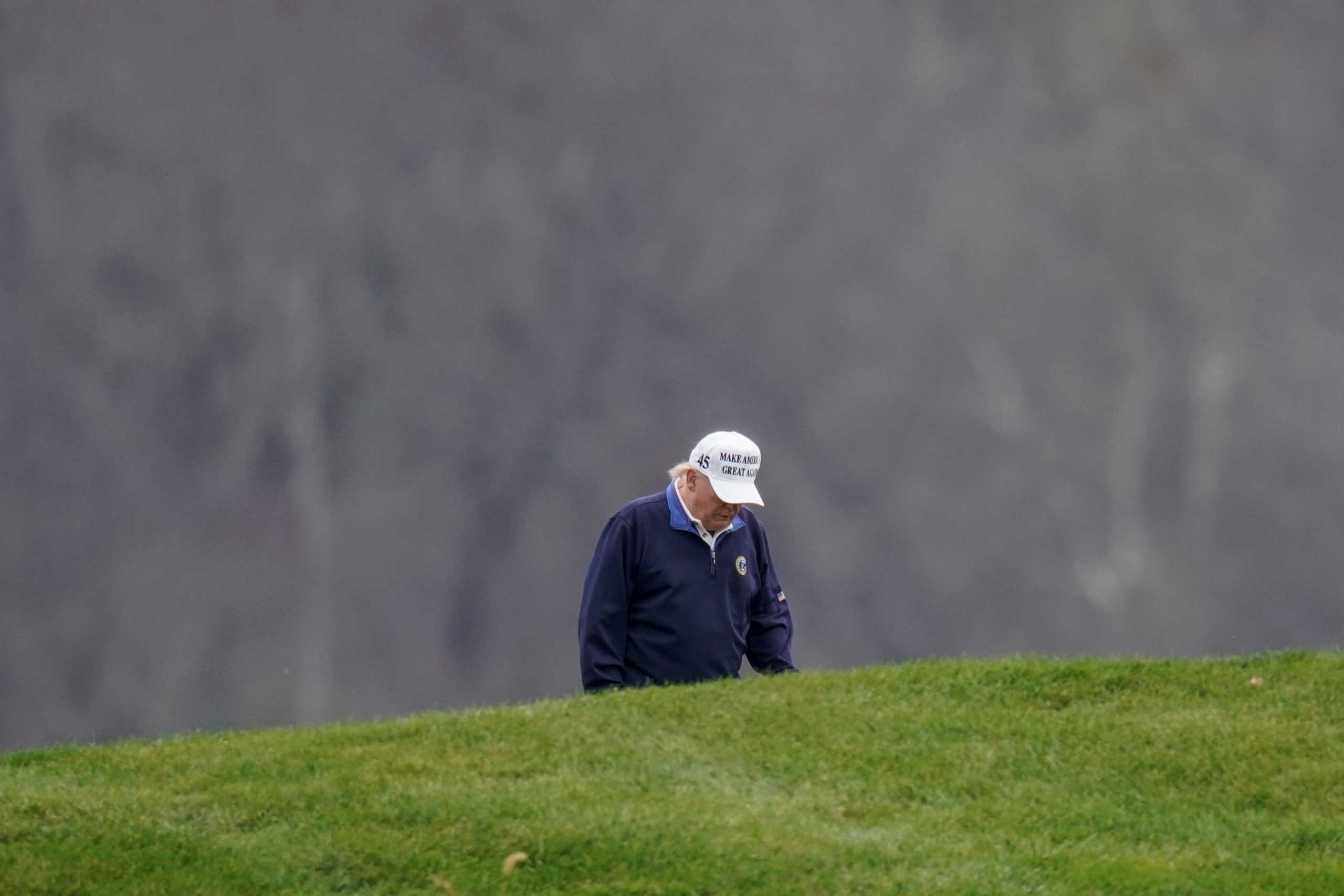 U.S. President Donald Trump plays golf at the Trump National Golf Club in Sterling, Virginia, U.S., November 15, 2020.      REUTERS