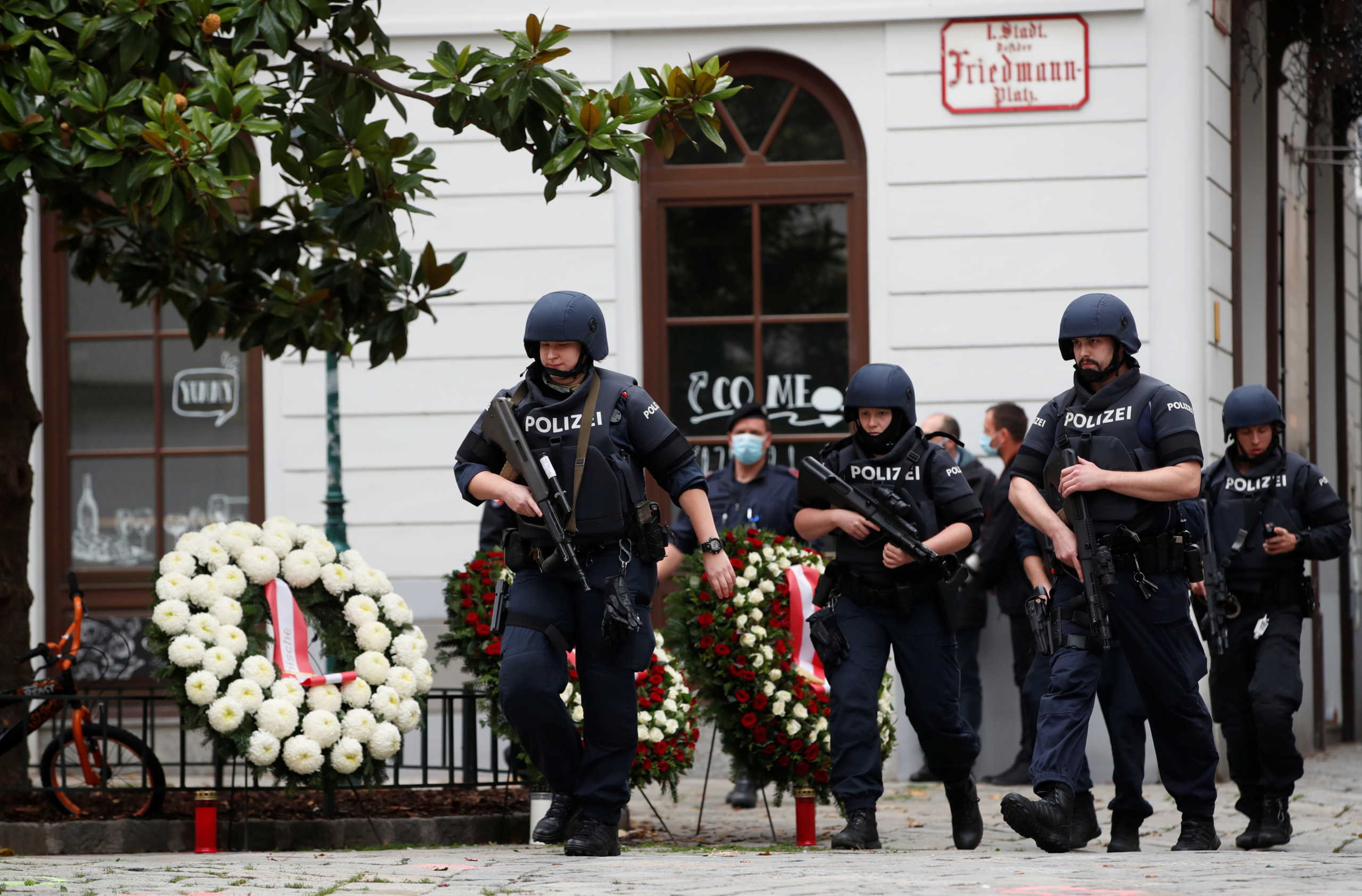 Police officers walk at the site of wreath laying ceremony after exchanges of gunfire in Vienna, Austria November 3, 2020. REUTERS