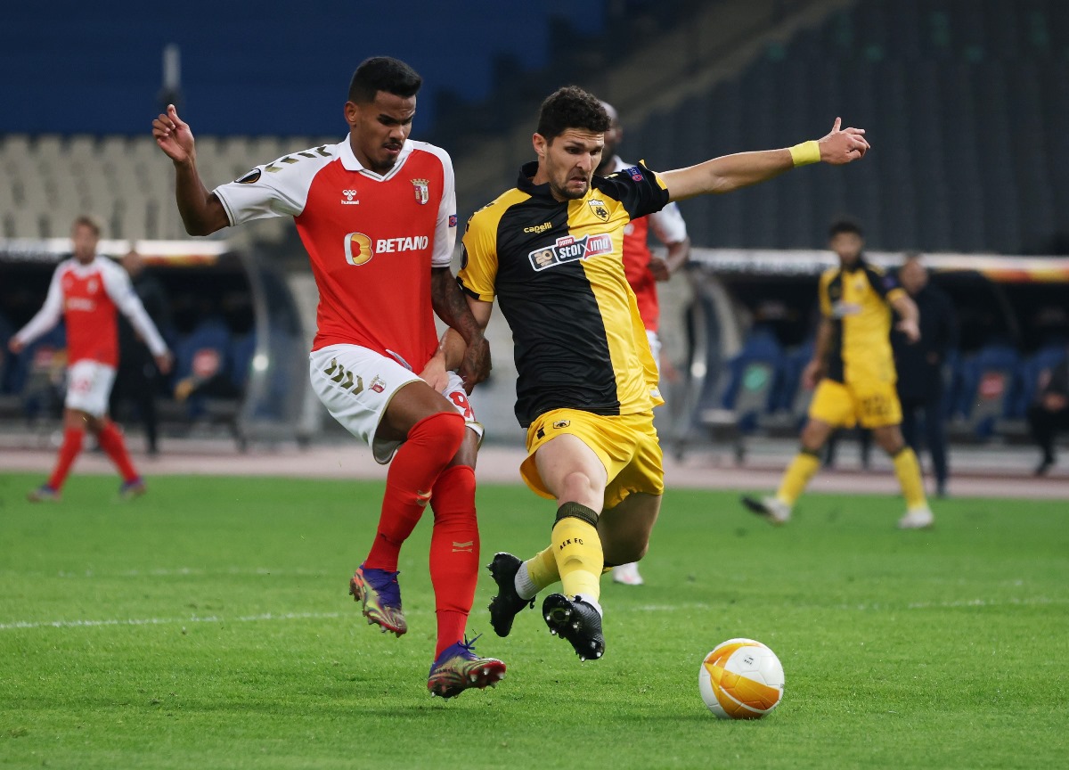 Soccer Football - Europa League - Group G - AEK Athens v S.C. Braga - OAKA Spiros Louis, Athens, Greece - December 3, 2020 S.C. Braga's Galeno in action with AEK Athens' Christos Albanis REUTERS