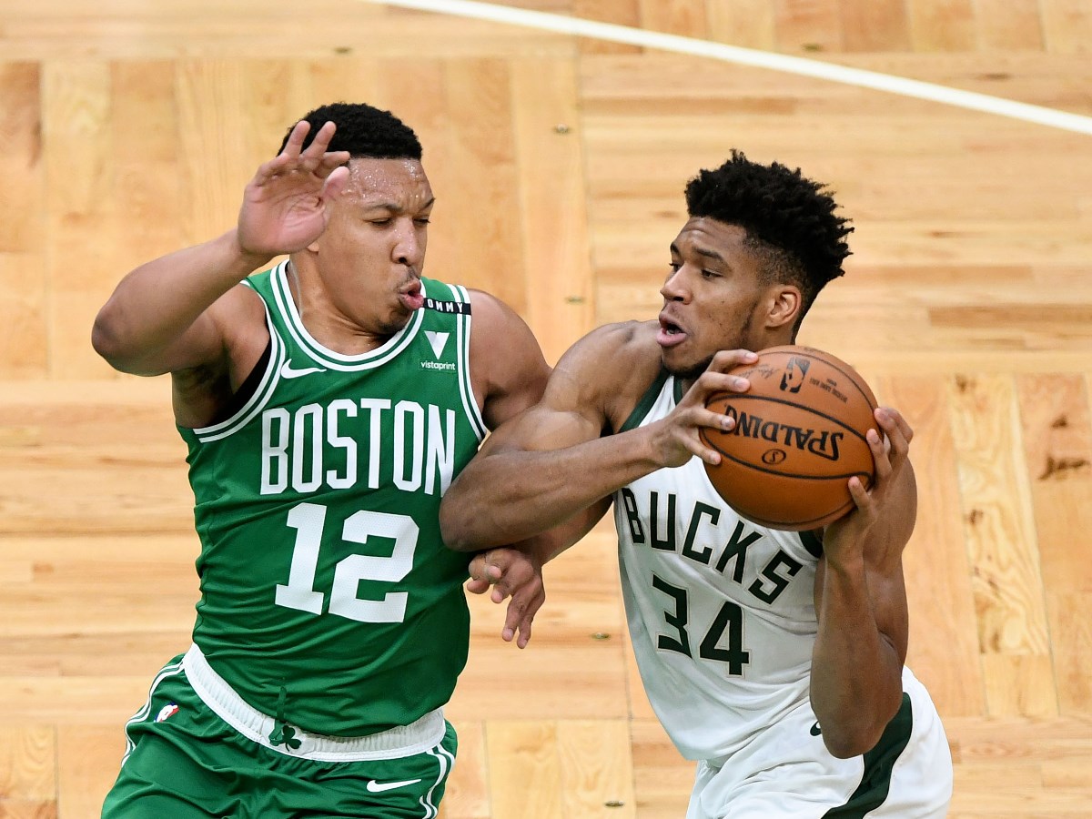 Dec 23, 2020; Boston, Massachusetts, USA; Milwaukee Bucks forward Giannis Antetokounmpo (34) drives to the basket against Boston Celtics forward Grant Williams (12) during the first half at the TD Garden. Mandatory Credit: Brian Fluharty-USA TODAY Sports