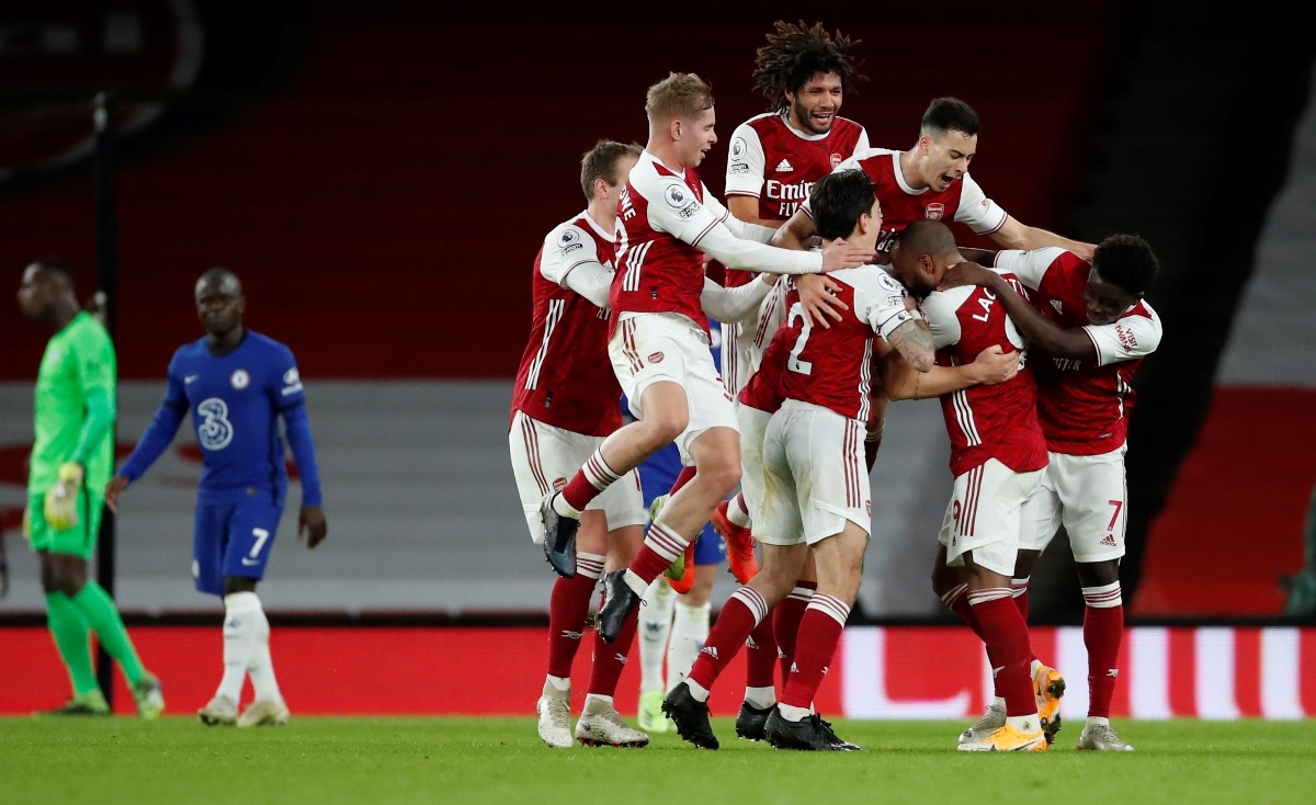 Soccer Football - Premier League - Arsenal v Chelsea - Emirates Stadium, London, Britain - December 26, 2020 Arsenal's Granit Xhaka celebrates scoring their second goal with teammates Pool via REUTERS
