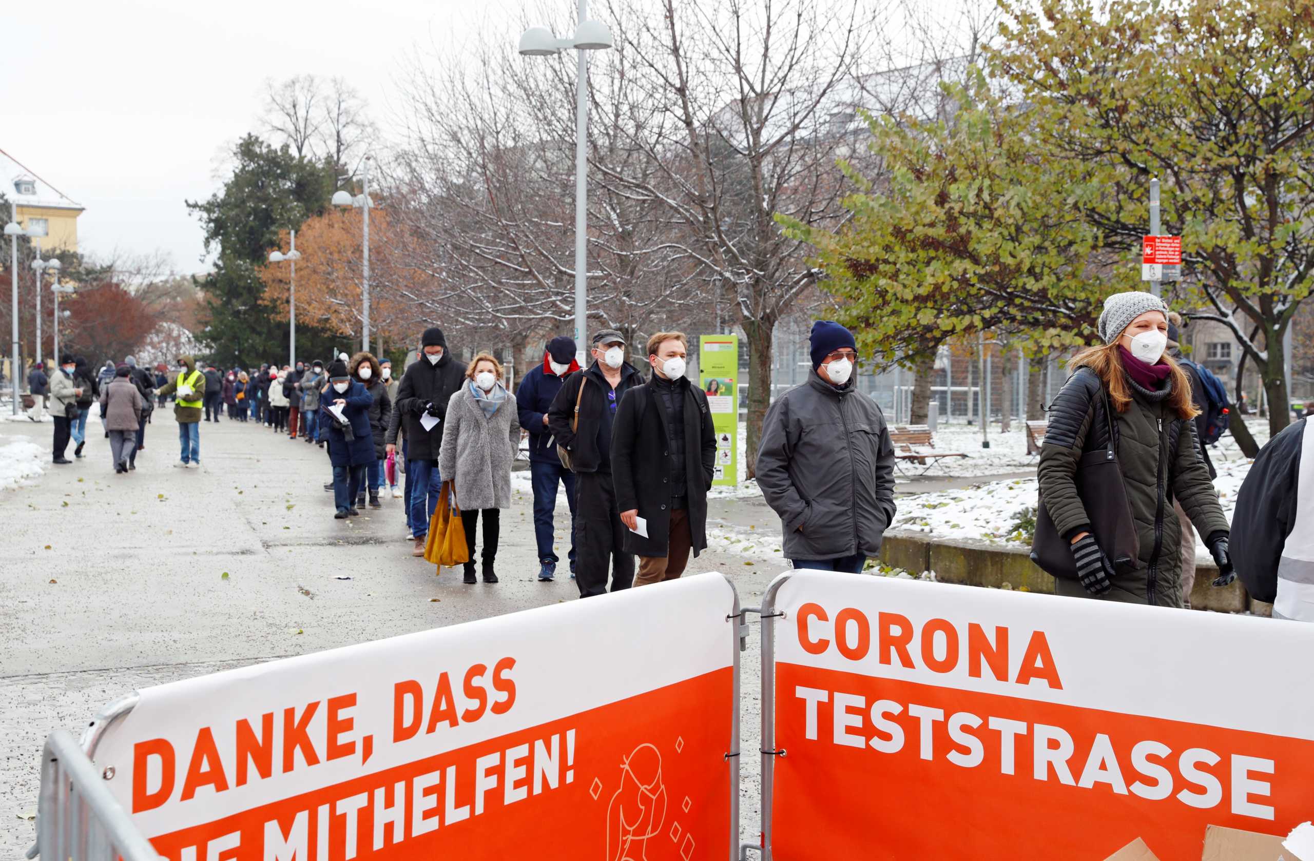 People queue before a mass testing on the coronavirus disease (COVID-19) in Vienna, Austria, December 4, 2020. REUTERS