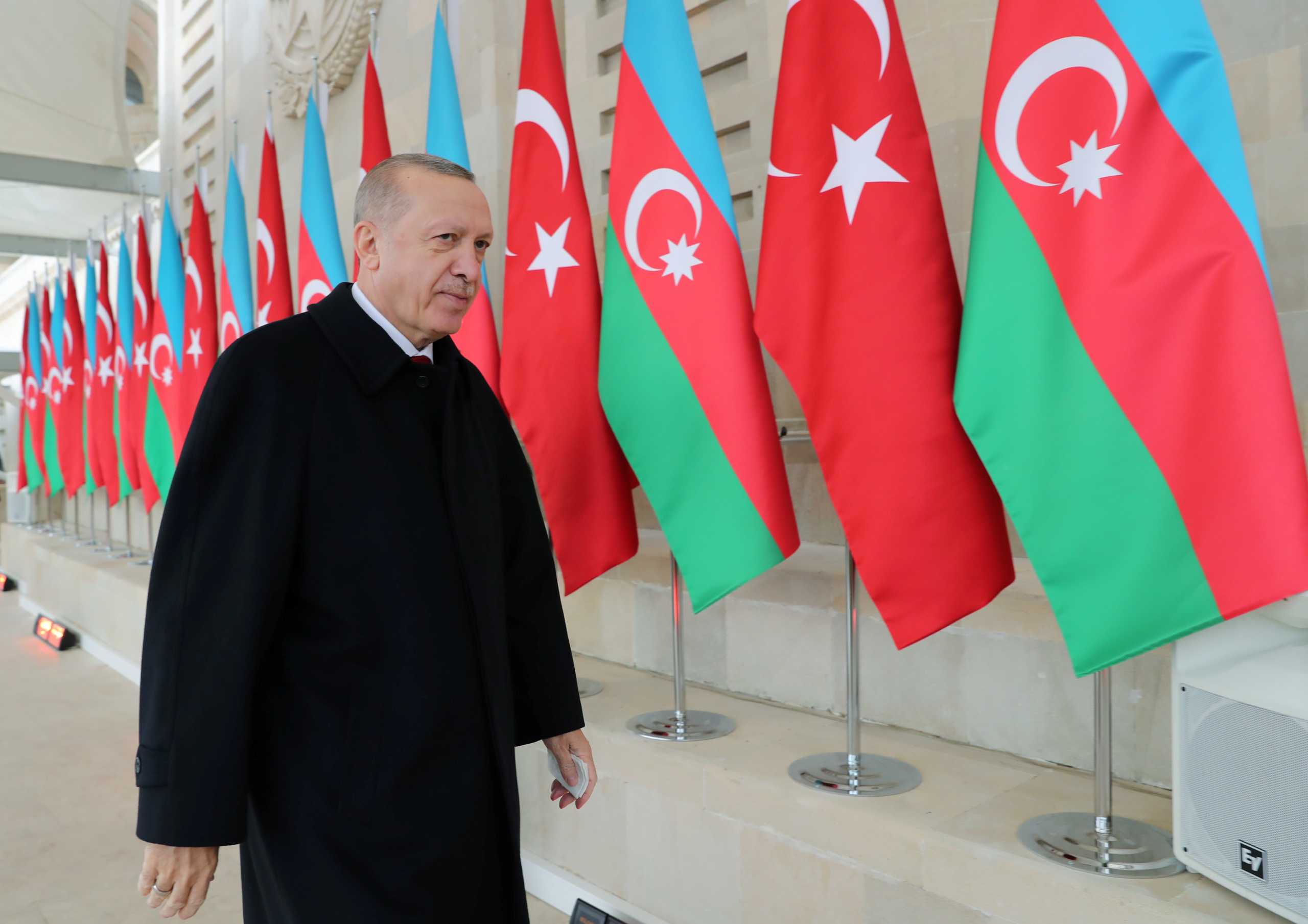 Turkish President Tayyip Erdogan arrives at a military parade to mark the victory on Nagorno-Karabakh conflict, in Baku, Azerbaijan December 10, 2020. Murat Cetinmuhurdar