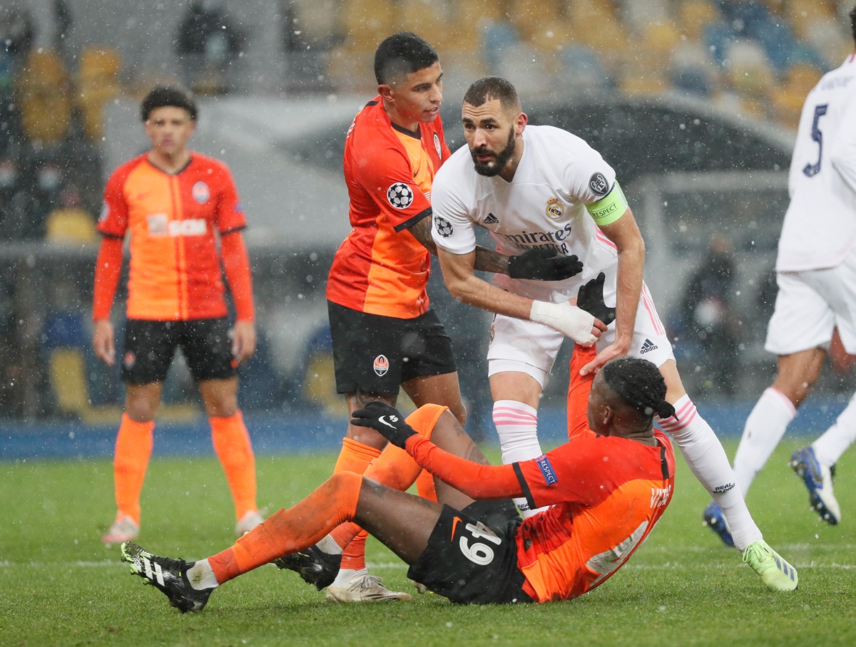Soccer Football - Champions League - Group B - Shakhtar Donetsk v Real Madrid - NSC Olimpiyskiy, Kyiv, Ukraine - December 1, 2020 Shakhtar Donetsk's Vitao in action with Real Madrid's Karim Benzema REUTERS