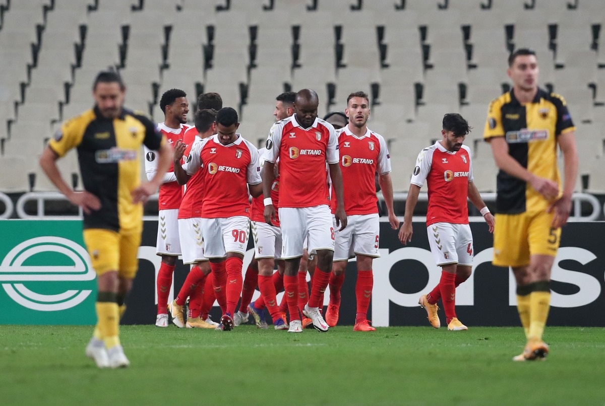 Soccer Football - Europa League - Group G - AEK Athens v Sporting Braga - OAKA Spiros Louis, Athens, Greece - December 3, 2020 S.C. Braga's Vitor Tormena celebrates scoring their first goal with teammates before the match REUTERS