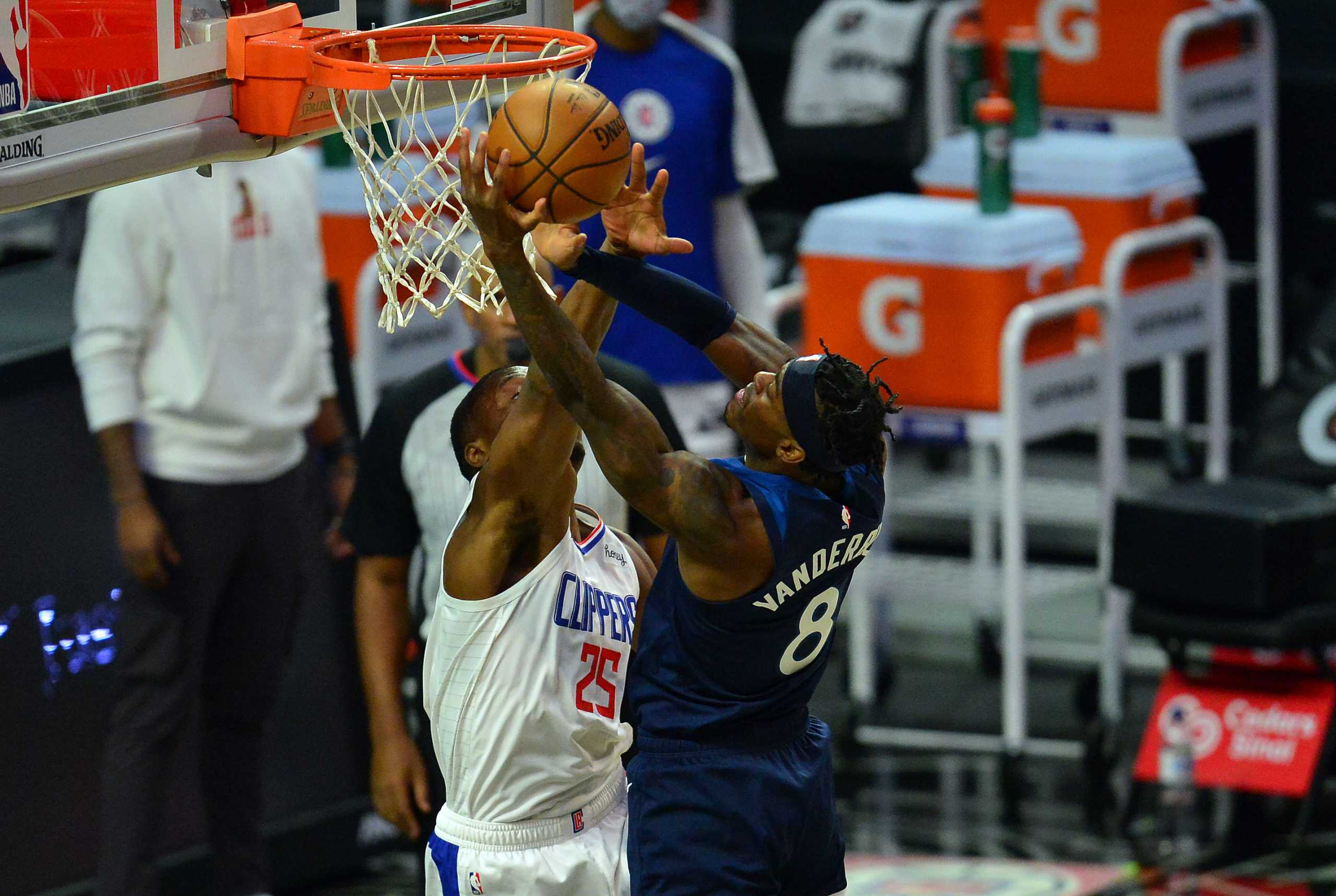 Dec 29, 2020; Los Angeles, California, USA; Minnesota Timberwolves forward Jarred Vanderbilt (8) moves to the basket against Los Angeles Clippers forward Mfiondu Kabengele (25) during the second half at Staples Center. Mandatory Credit: Gary A. Vasquez-USA TODAY Sports
