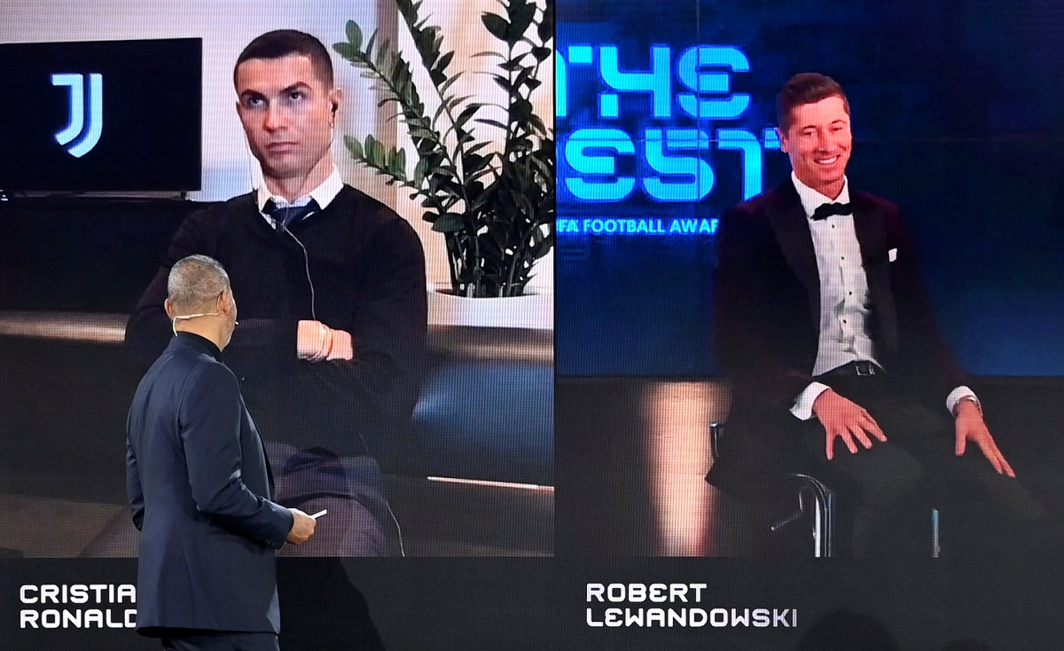 Soccer Football - The Best FIFA Football Awards - Zurich, Switzerland - December 17, 2020 Robert Lewandowski is awarded The Best FIFA Men's Player as Cristiano Ronaldo looks on Pool via REUTERS