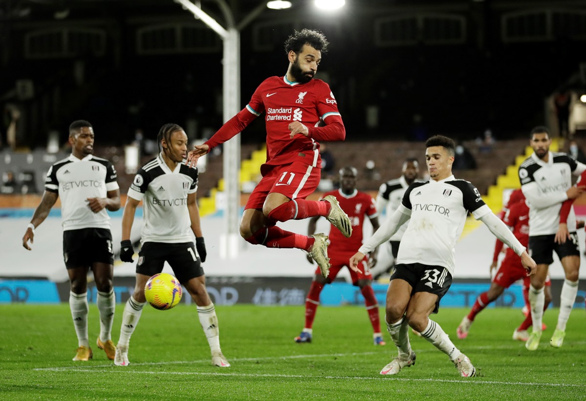 Soccer Football - Premier League - Fulham v Liverpool - Craven Cottage, London, Britain - December 13, 2020 Liverpool's Mohamed Salah in action with Fulham's Antonee Robinson Pool via REUTERS