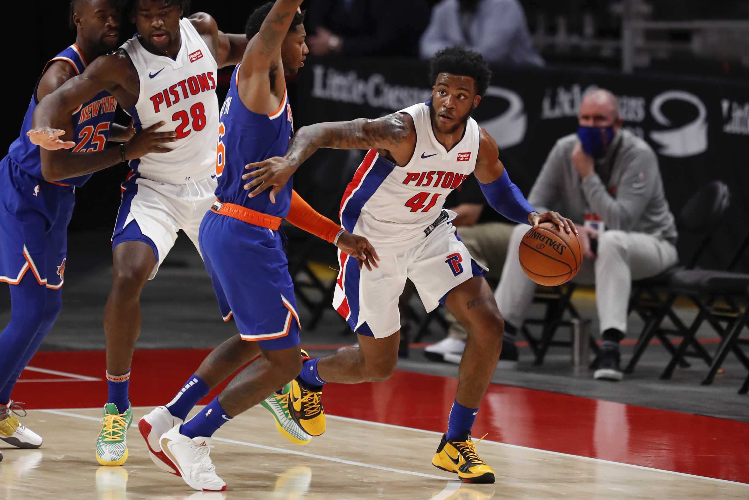 Dec 11, 2020; Detroit, Michigan, USA; Detroit Pistons guard Saddiq Bey (41) gets defended by New York Knicks guard Elfrid Payton (6) during the fourth quarter at Little Caesars Arena. Mandatory Credit: Raj Mehta-USA TODAY Sports