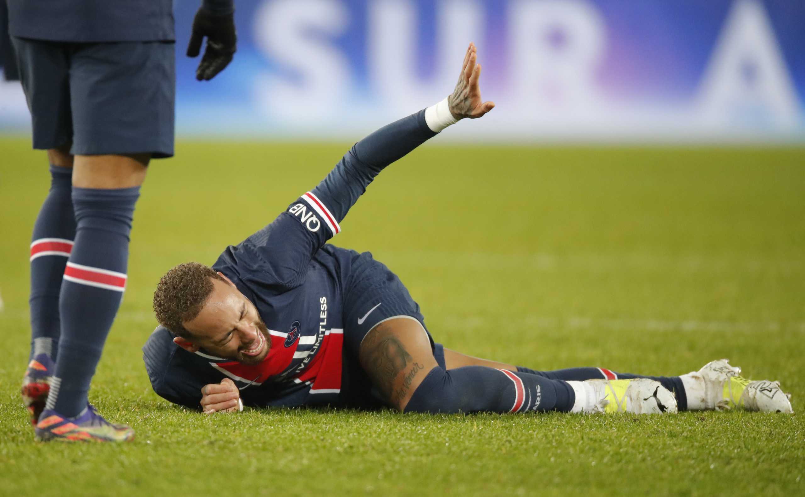 Soccer Football - Ligue 1 - Paris St Germain v Olympique Lyonnais - Parc des Princes, Paris, France - December 13, 2020 Paris St Germain's Neymar reacts after sustaining an injury REUTERS