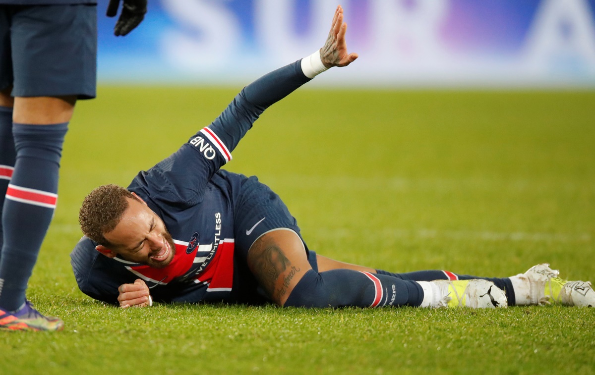 FILE PHOTO: Soccer Football - Ligue 1 - Paris St Germain v Olympique Lyonnais - Parc des Princes, Paris, France - December 13, 2020 Paris St Germain's Neymar reacts after sustaining an injury REUTERS