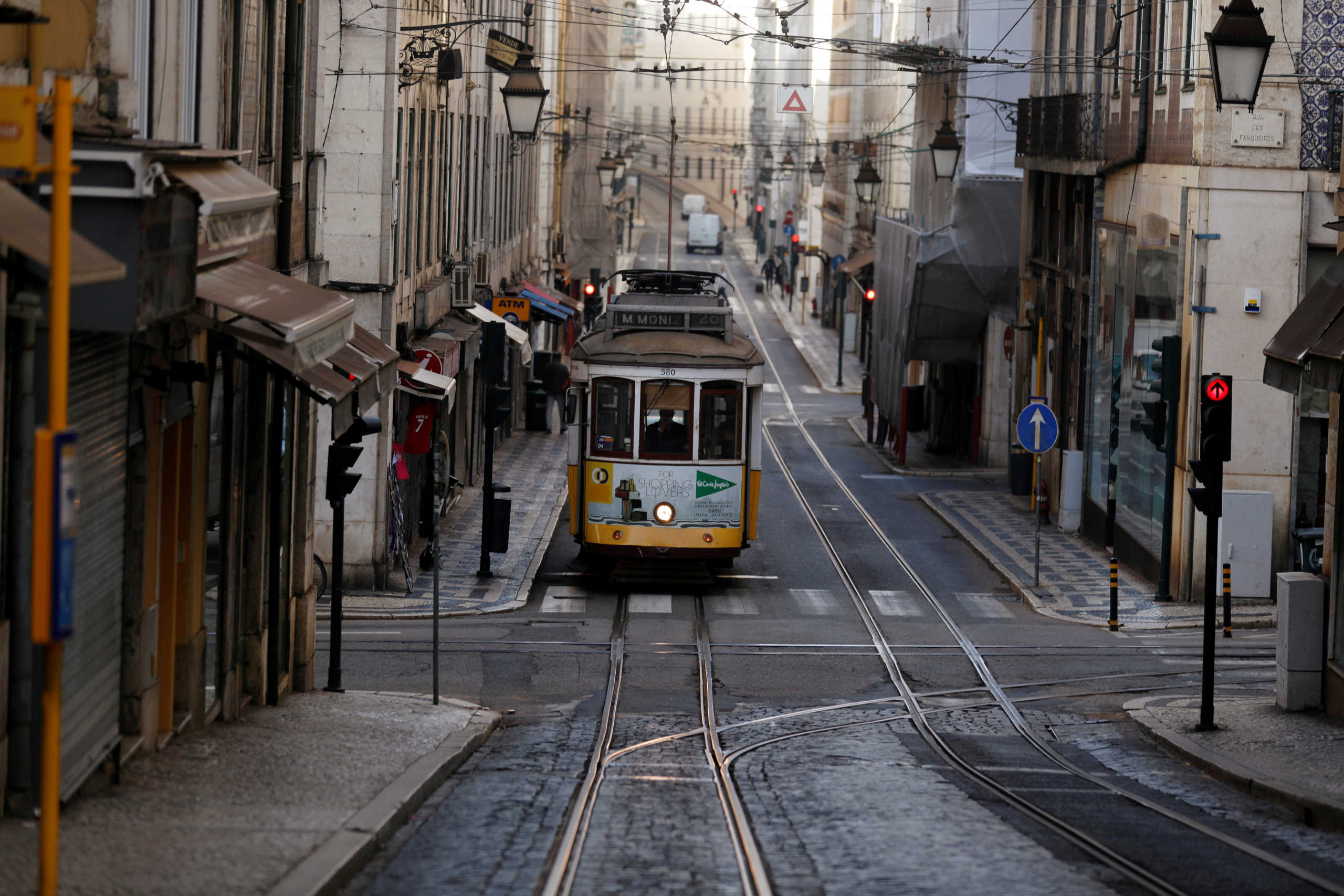 FILE PHOTO: A tram is pictured on an empty street during the coronavirus disease (COVID-19) outbreak, in downtown Lisbon, Portugal October 31, 2020.  REUTERS
