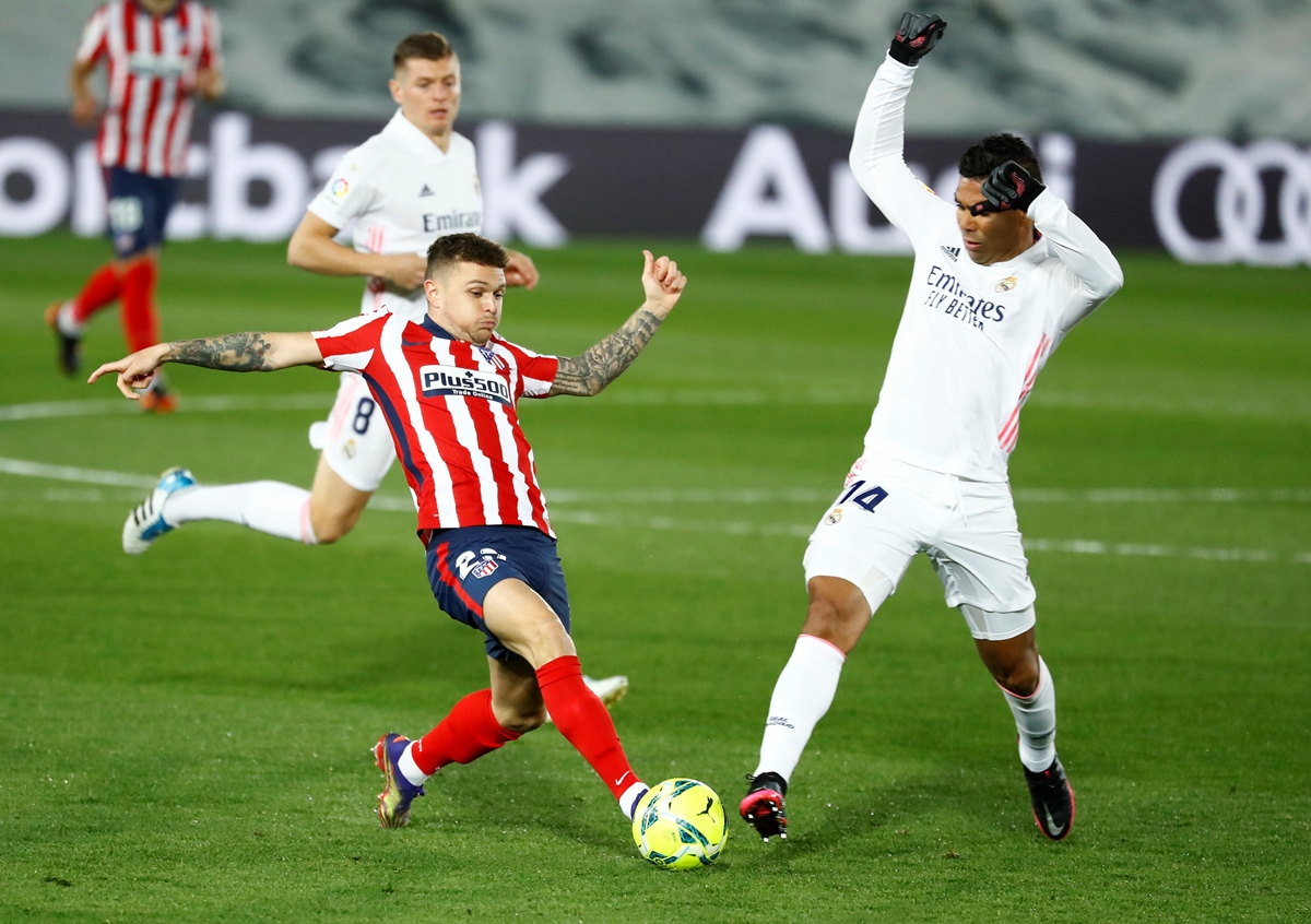 Soccer Football - La Liga Santander - Real Madrid v Atletico Madrid - Estadio Alfredo Di Stefano, Madrid, Spain - December 12, 2020 Real Madrid's Casemiro in action with Atletico Madrid's Kieran Trippier REUTERS