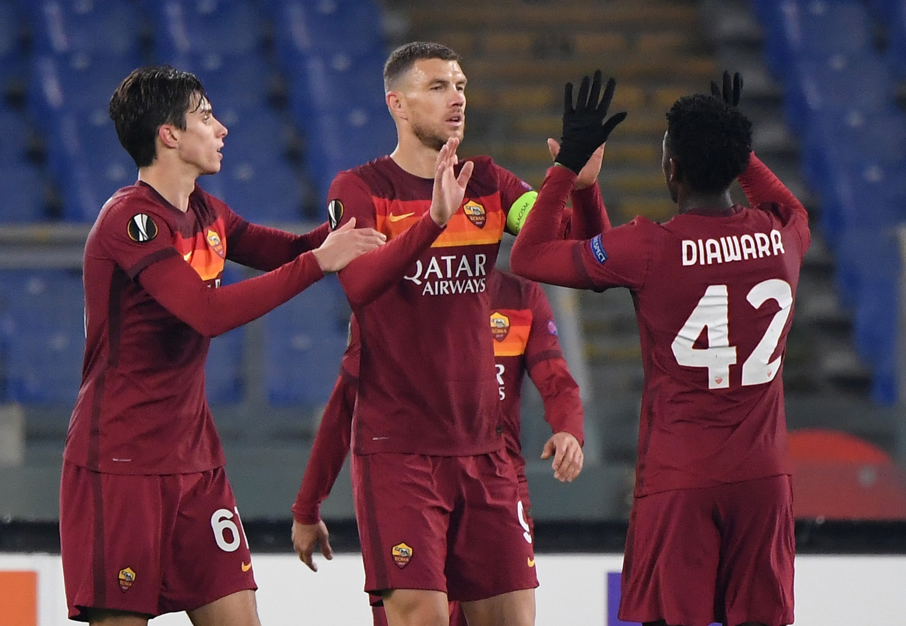 Soccer Football - Europa League - Group A - AS Roma v Young Boys - Stadio Olimpico, Rome, Italy - December 3, 2020 AS Roma's Edin Dzeko celebrates scoring their third goal with Riccardo Calafiori and Amadou Diawara REUTERS