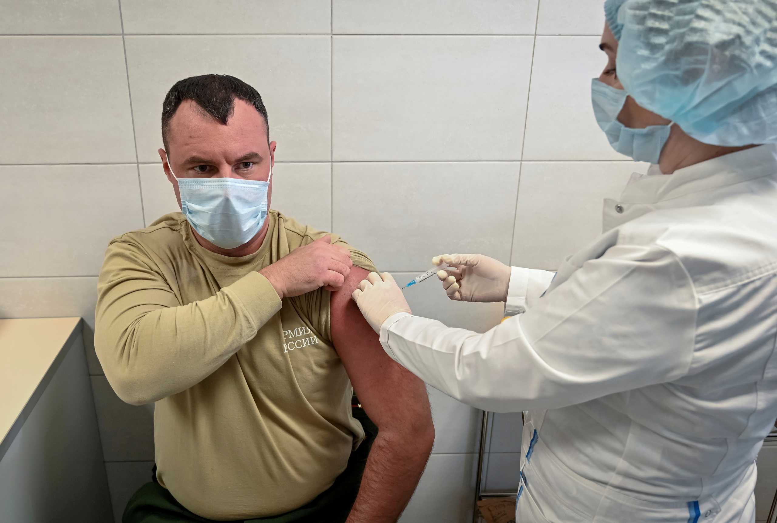 FILE PHOTO: A Russian Army service member receives an injection with Sputnik V (Gam-COVID-Vac) vaccine against the coronavirus disease (COVID-19) at a clinic in the city of Rostov-On-Don, Russia December 22, 2020.  REUTERS