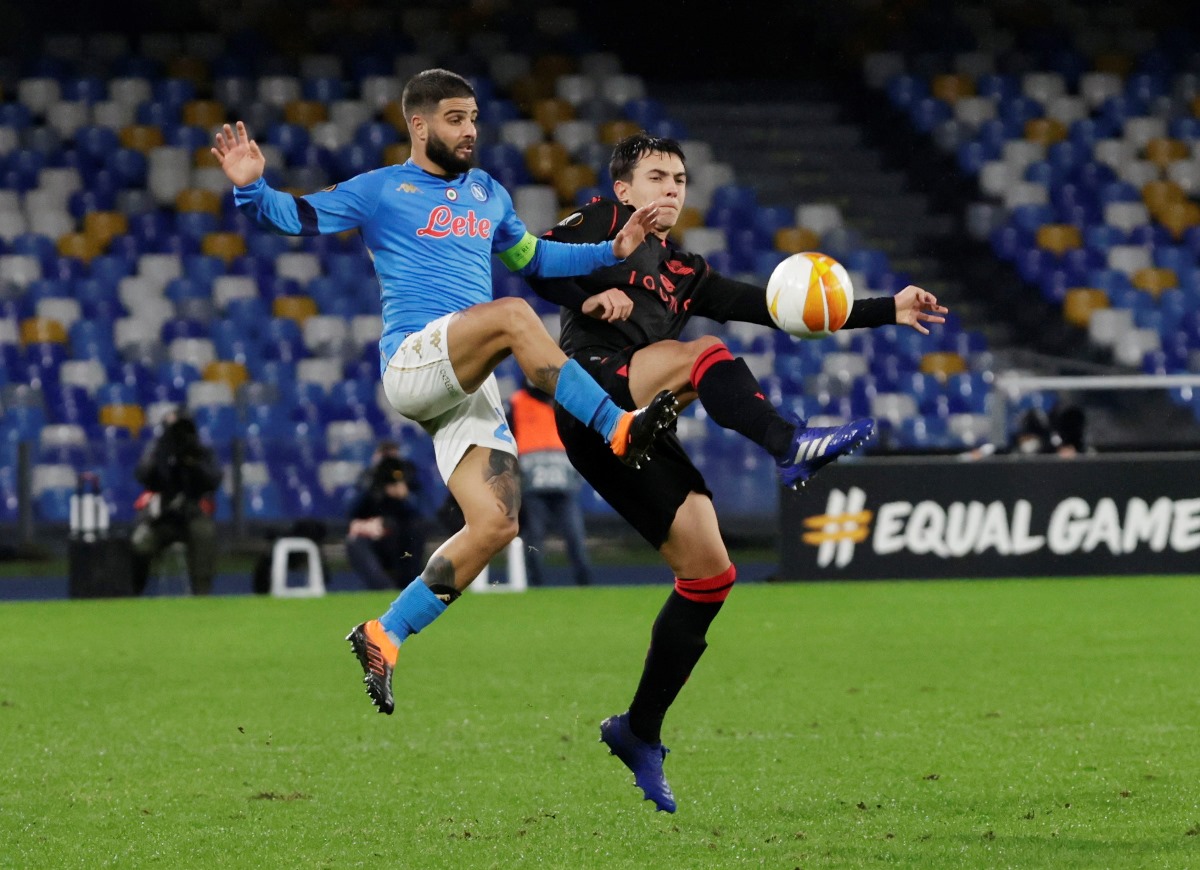 Soccer Football - Europa League - Group F - Napoli v Real Sociedad - Stadio Diego Armando Maradona, Naples, Italy - December 10, 2020 Napoli's Lorenzo Insigne in action with Real Sociedad's Martin Zubimendi REUTERS