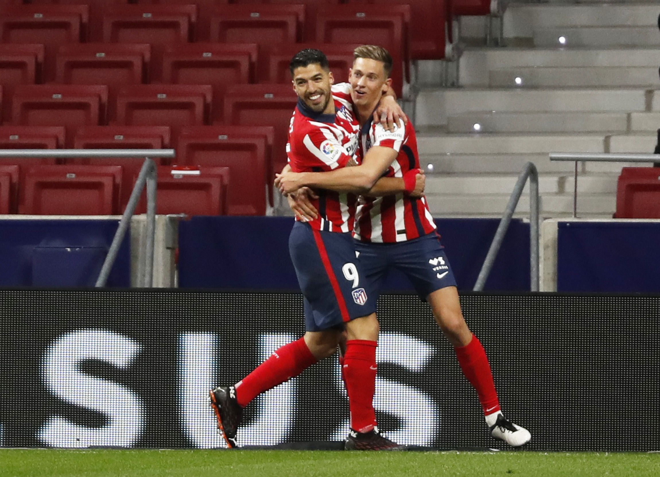 Soccer Football - La Liga Santander - Atletico Madrid v Getafe - Wanda Metropolitano, Madrid, Spain - December 30, 2020 Atletico Madrid's Luis Suarez celebrates scoring their first goal with teammates REUTERS